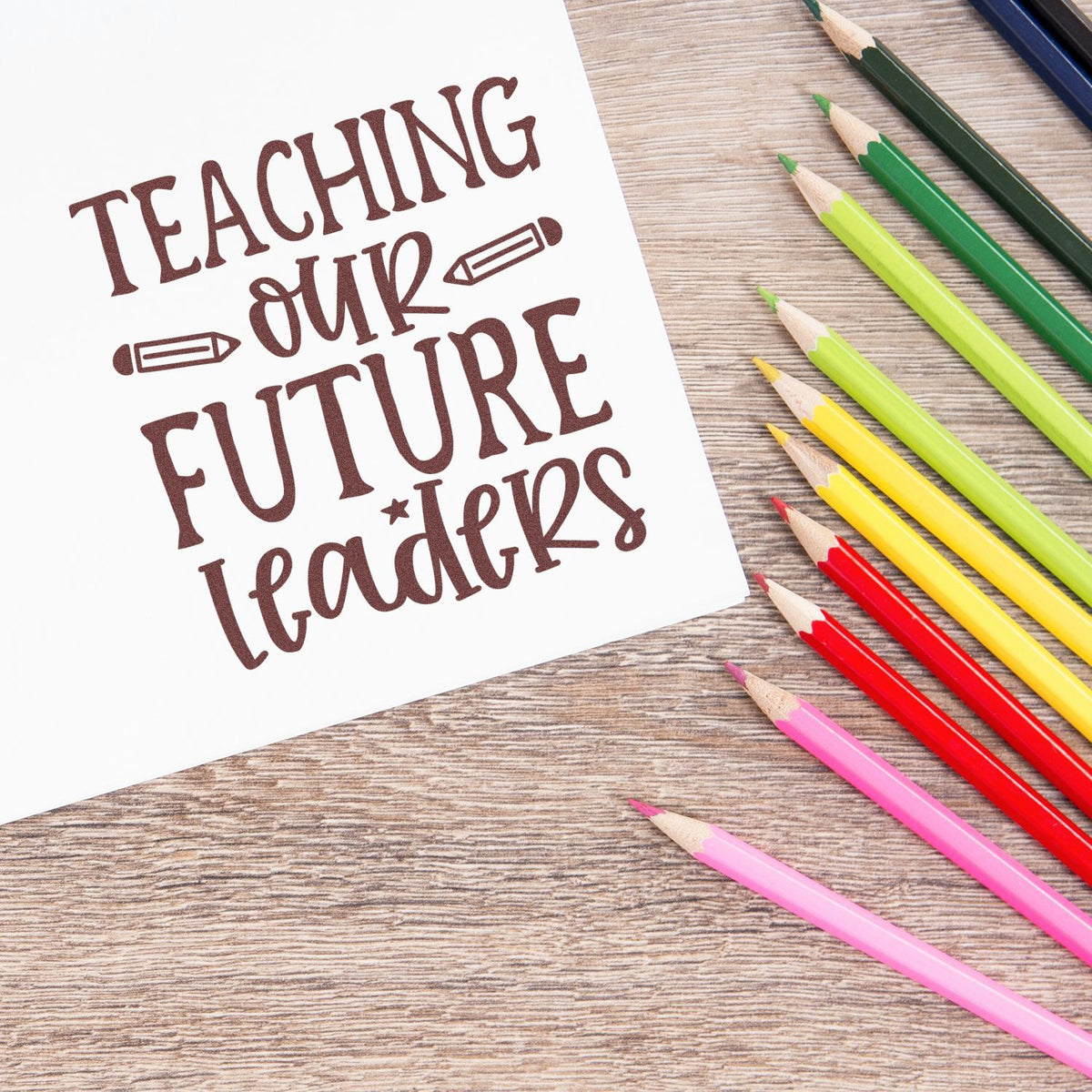 Teaching Our Future Leaders rubber stamp design with colored pencils, ideal for teacher crafts, classroom supplies, and school projects.