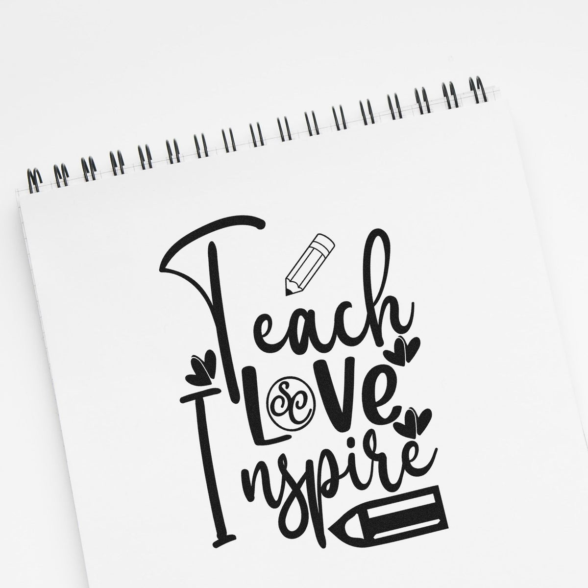 Teach Love Inspire teacher rubber stamp design with pencil and hearts for classroom crafts, planner pages, and educator gifts.