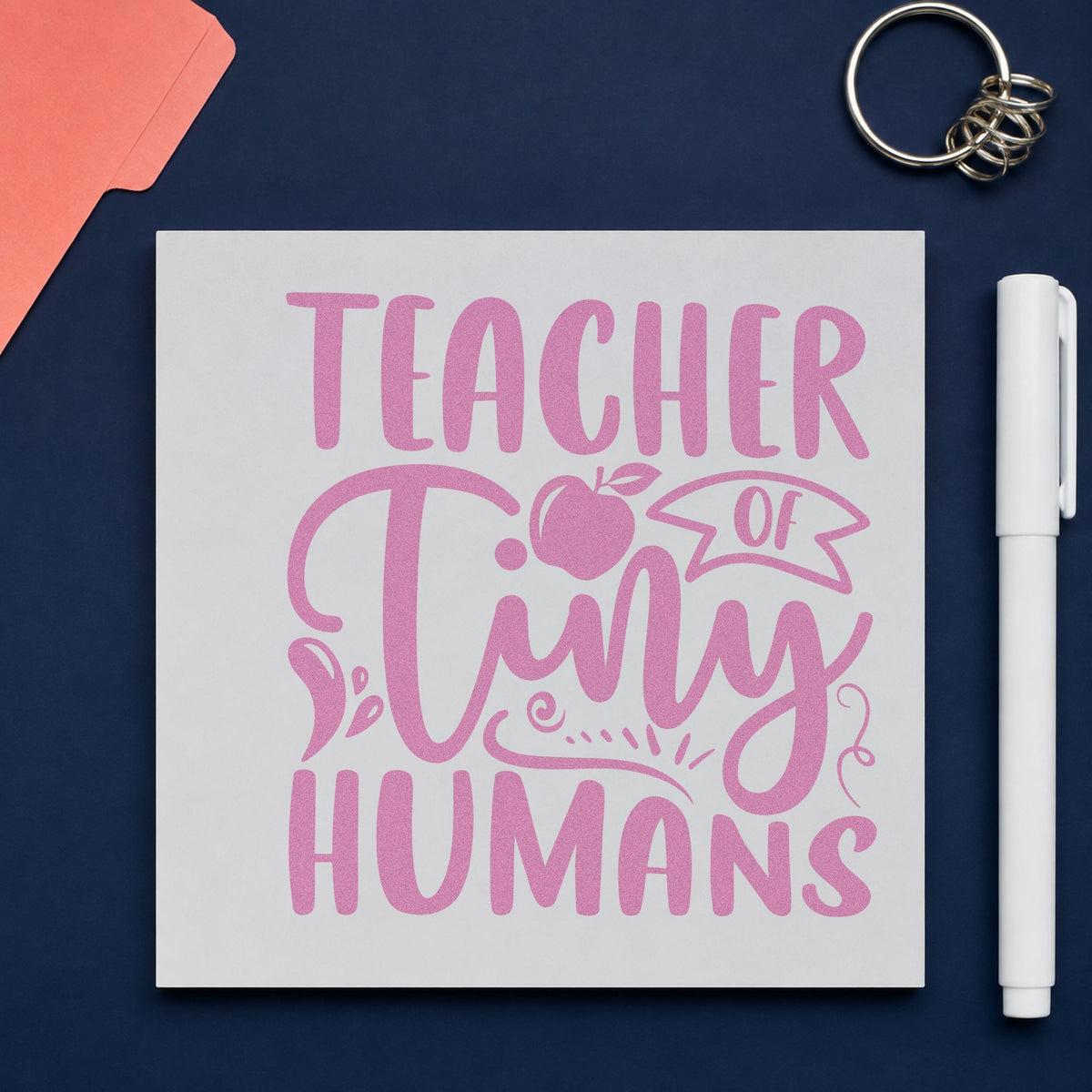 Teacher Of Tiny Humans Apple craft stamp in purple ink on cardstock, an easy option for christening tags.