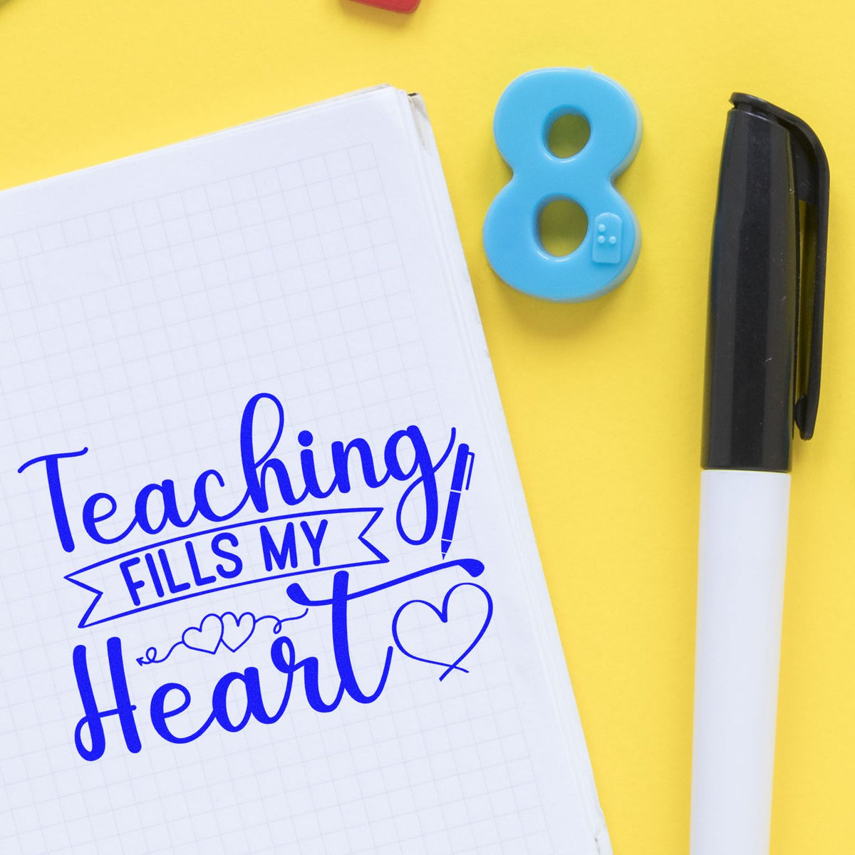 Teaching fills my heart rubber stamp design on notebook with stamp pen, ideal for teacher appreciation crafts
