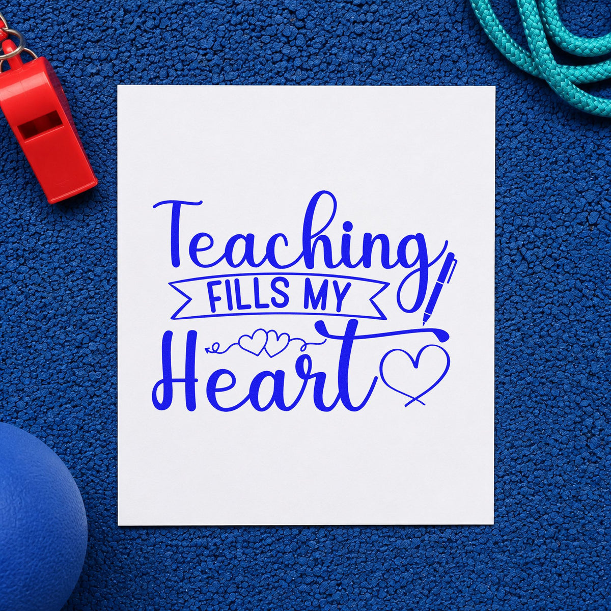 Teaching Fills My Heart craft stamp in blue ink on cardstock, an easy option for apron strap panels.