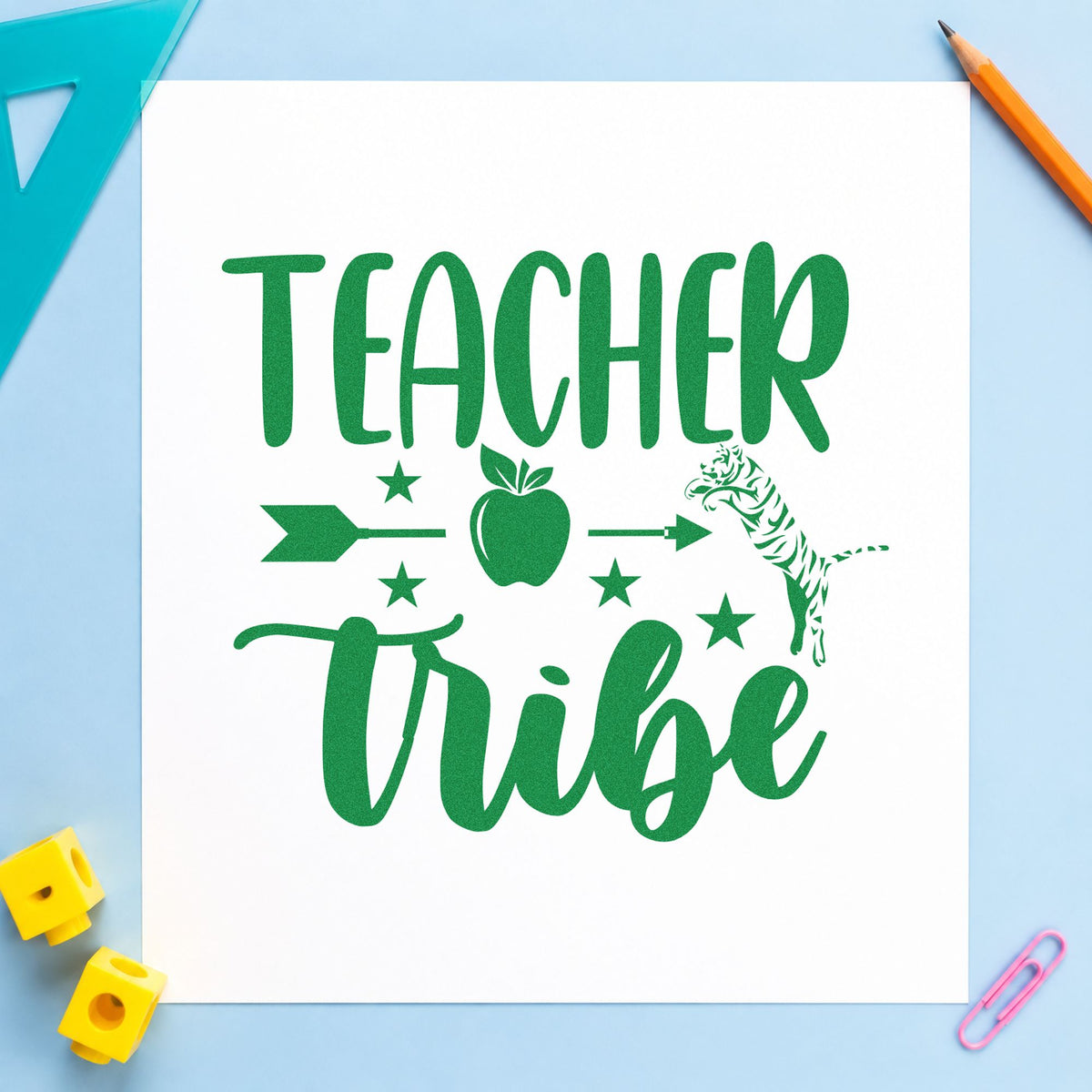 Teacher Tribe Arrow Apple craft stamp imprint in green ink on a handmade project, one idea being trail guide pages.
