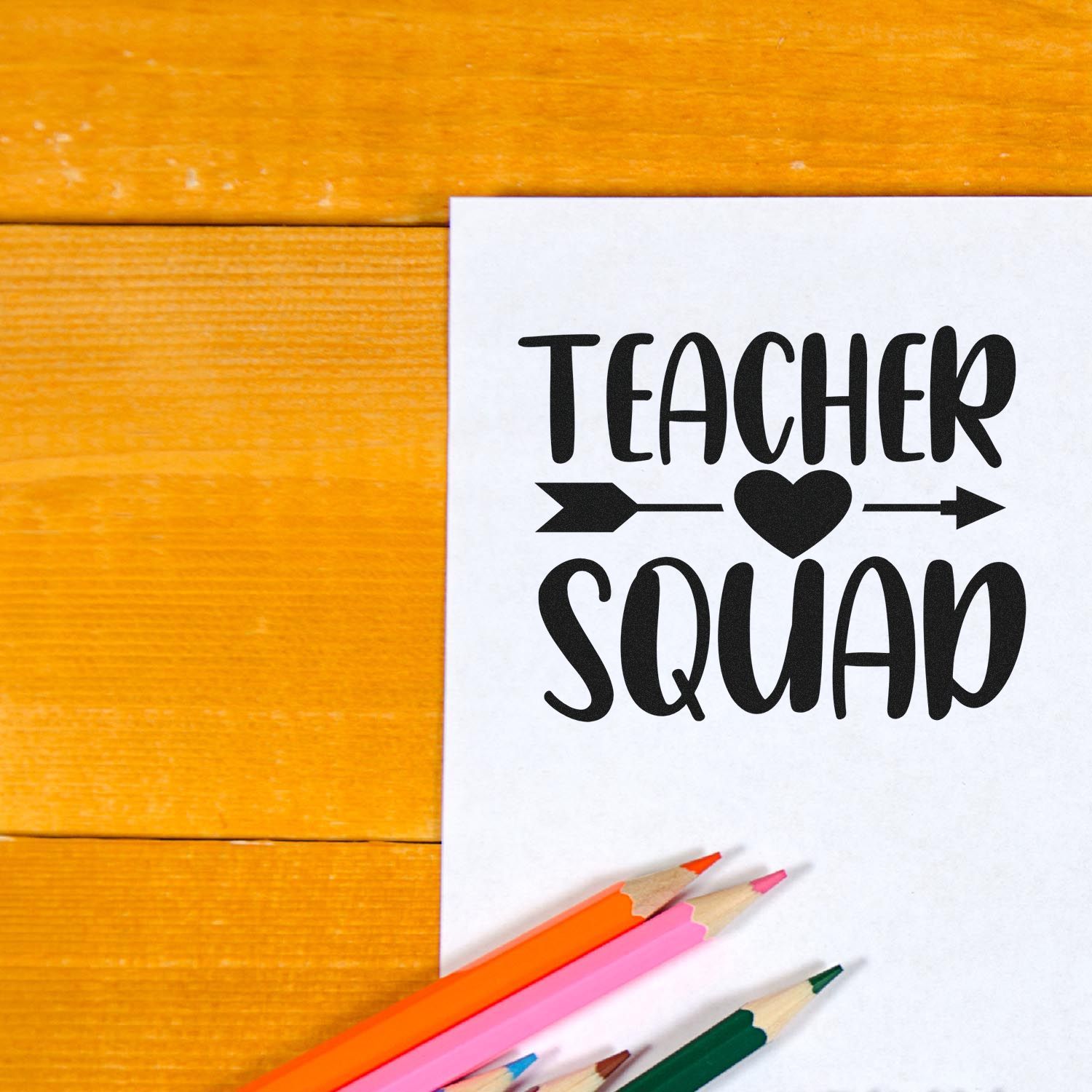 Teacher Squad rubber stamp design on paper with colored pencils, perfect for teacher appreciation, classroom gifts, and crafting.