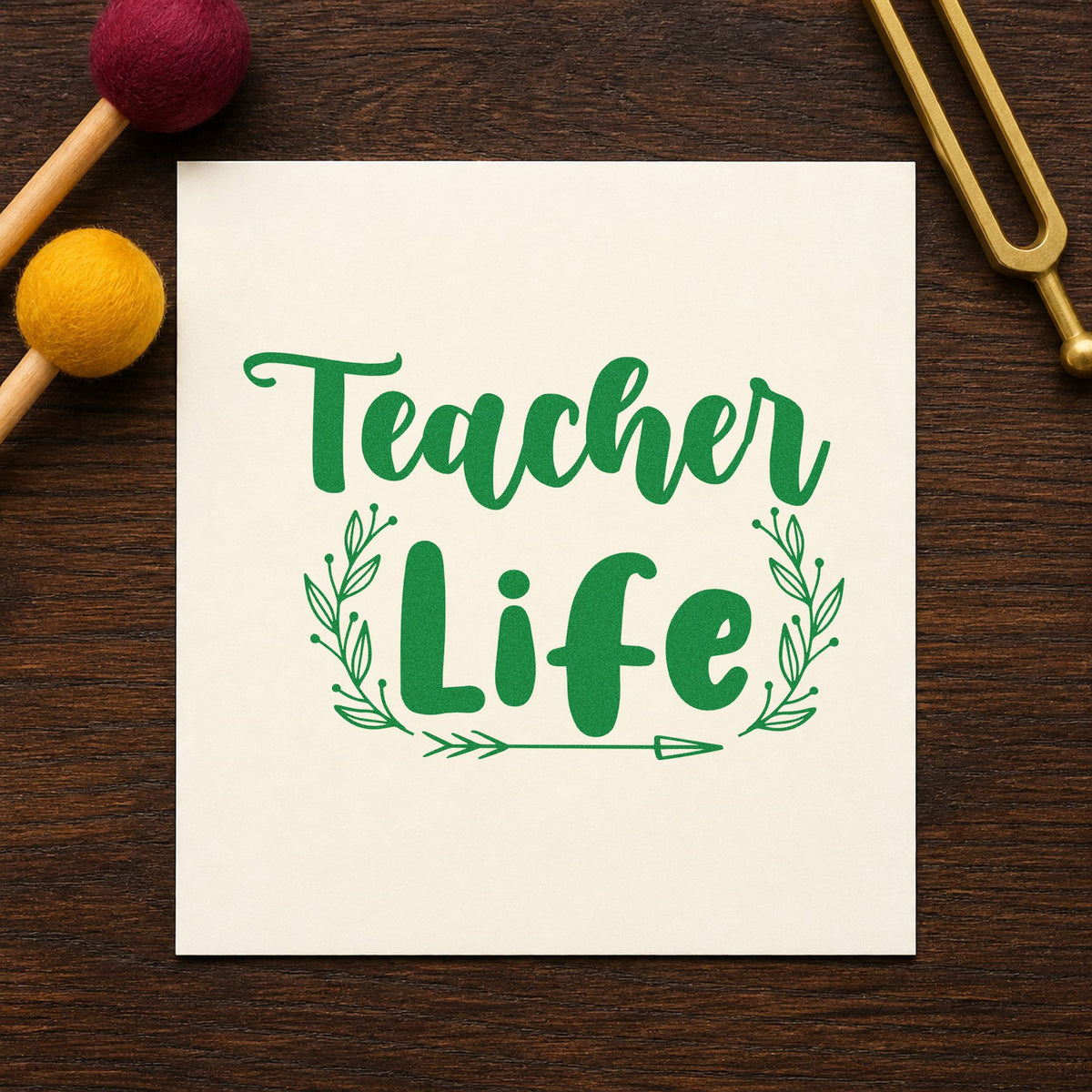 Teacher Life Leafy Frame craft stamp imprint in green ink on a handmade project, one idea being care guide pages.