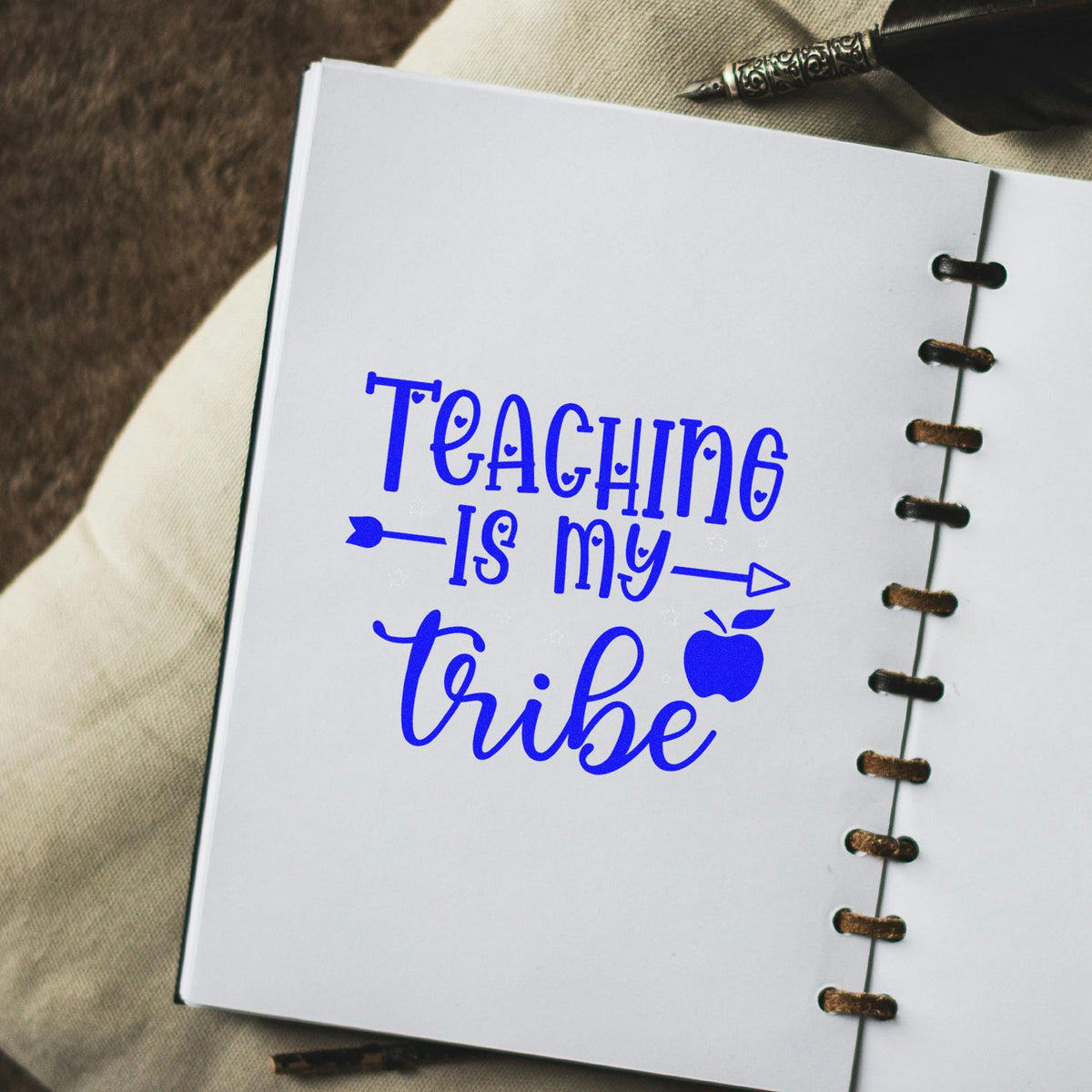 Blue Teaching is my tribe rubber stamp design on a notebook page, ideal for teacher crafts and classroom stamping.