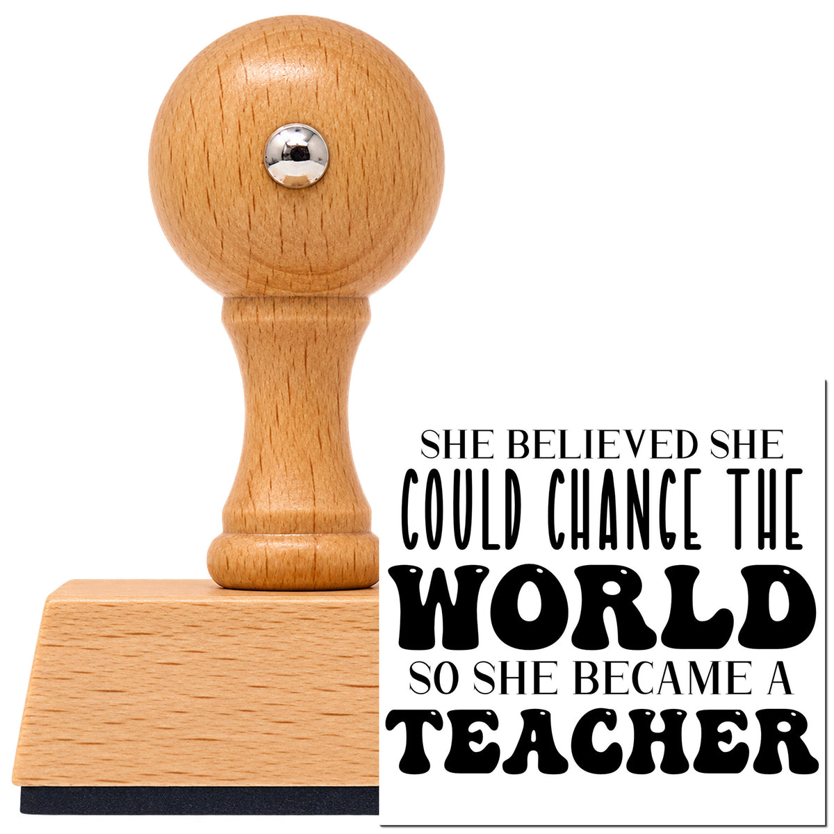 She Became A Teacher Vintage Pro rubber stamp in European beech wood with a round knob handle, shown beside its black imprint.