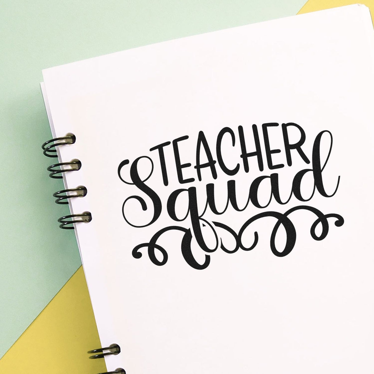 Teacher Squad rubber stamp design on notebook, perfect for classroom crafts, teacher gifts, and school planner personalization.