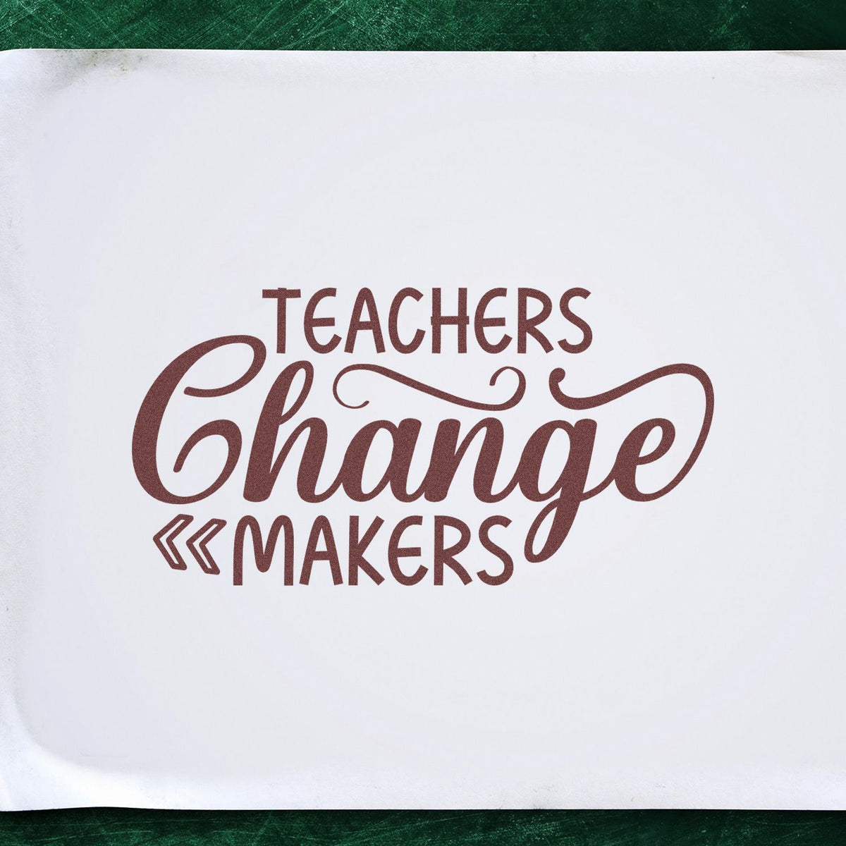 Teachers Change Makers rubber stamp shown in brown ink, stamped for projects such as pilot project tags.