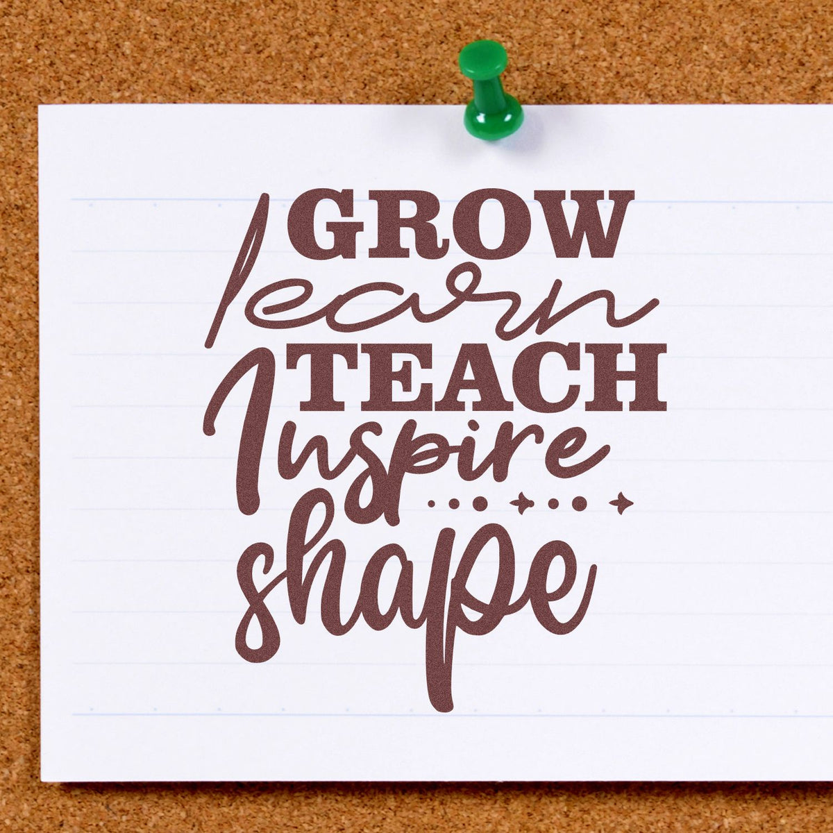 Rubber stamp design with inspirational quote Grow Learn Teach Inspire Shape on pinned paper for classroom decor.