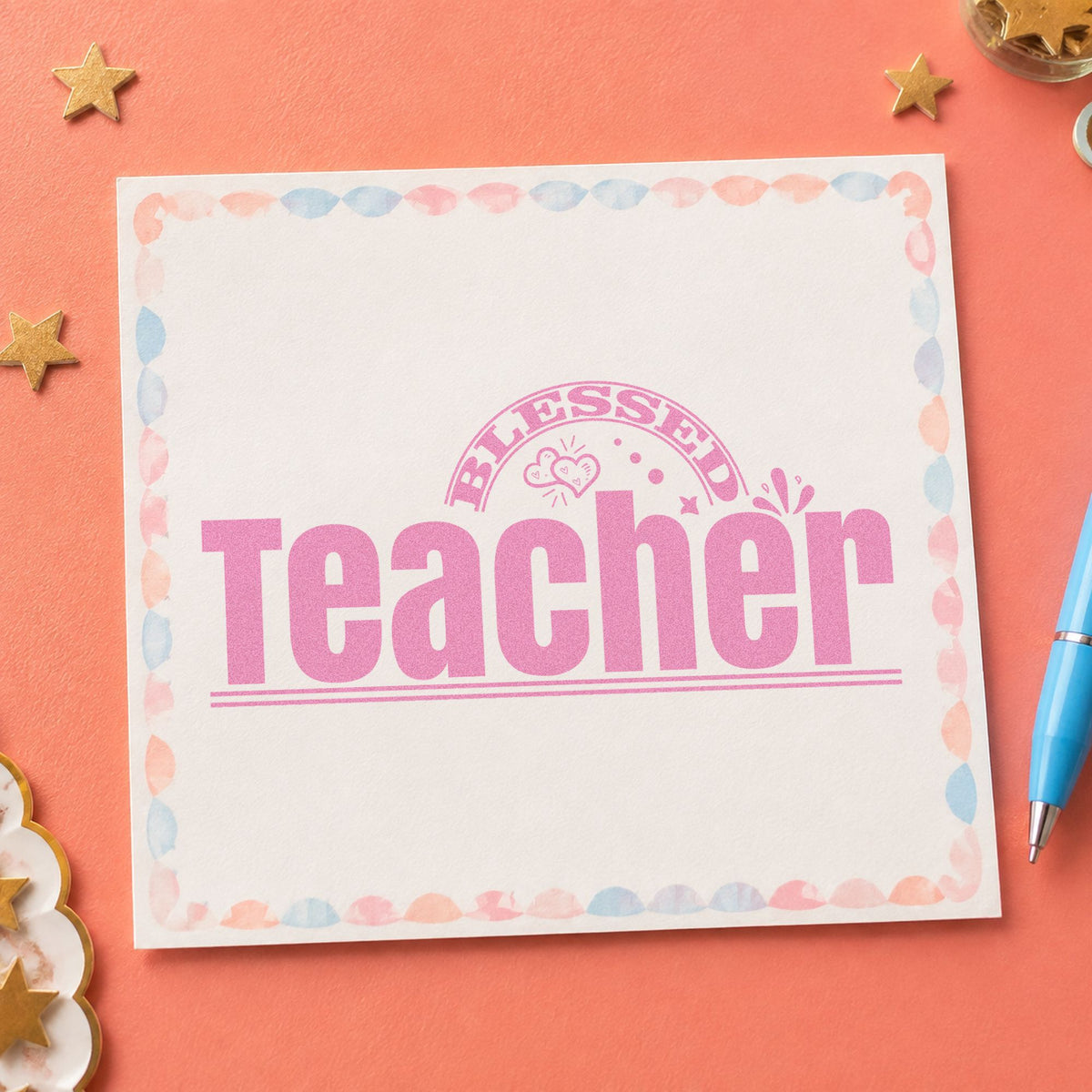 Teacher Rainbow And Flowers craft stamp in purple ink on cardstock, an easy option for welcome desk tags.