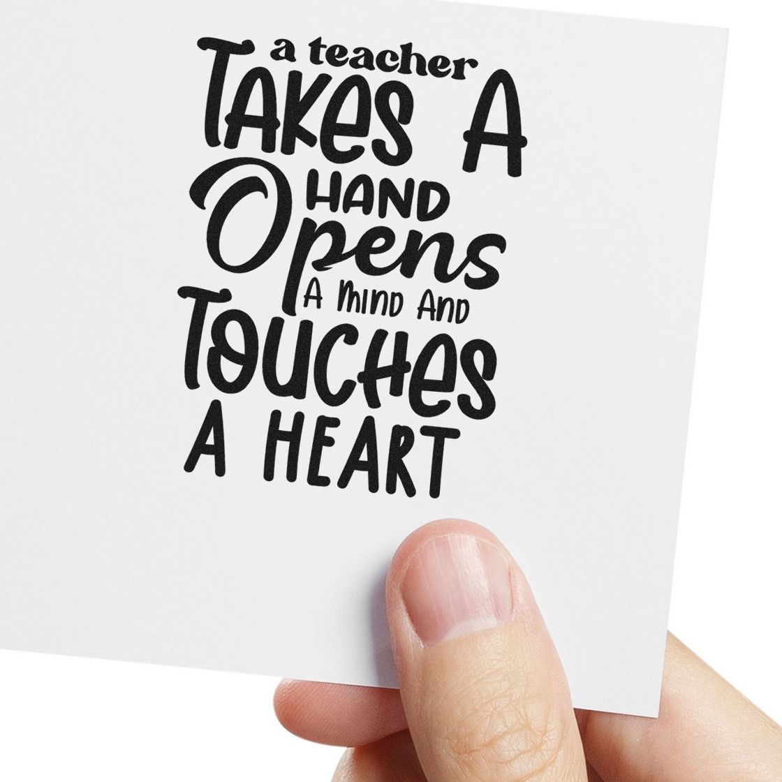 Teacher Takes Hand Opens Mind Pre-Inked Stamp – PSI imprint stamped in black ink. “A Teacher Takes a Hand Opens a Mind and Touches a Heart” appears in stacked decorative lettering.