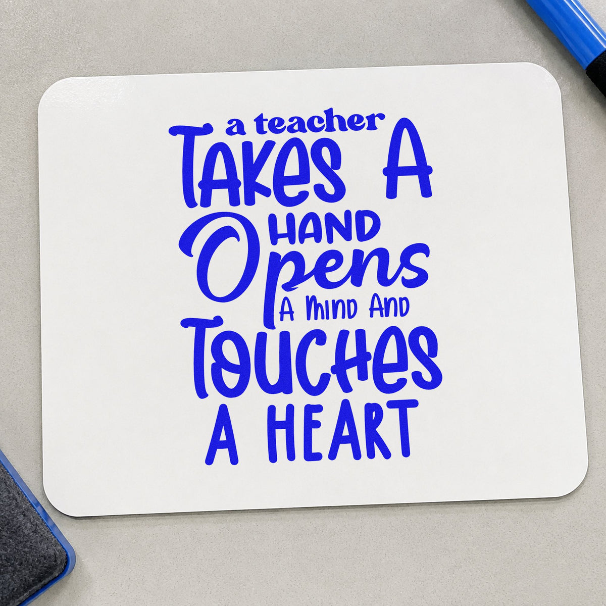 Teacher Takes Hand Opens Mind craft stamp in blue ink on cardstock, an easy option for bench cloth panels.