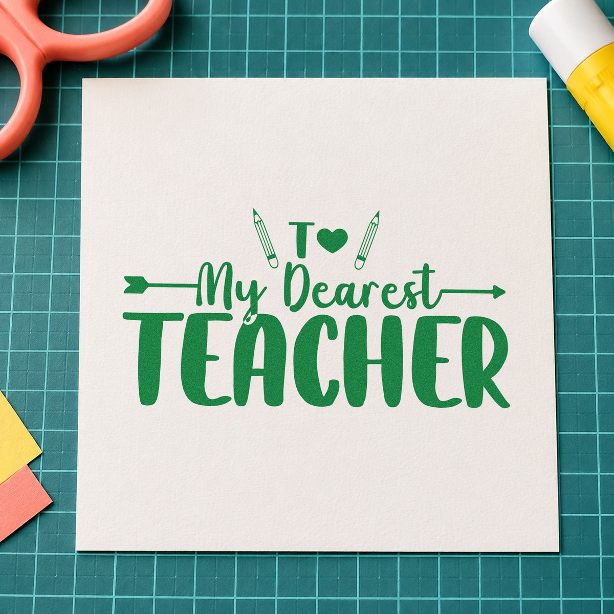 My Dearest Teacher craft stamp imprint in green ink on a handmade project, one idea being framed letter rack.