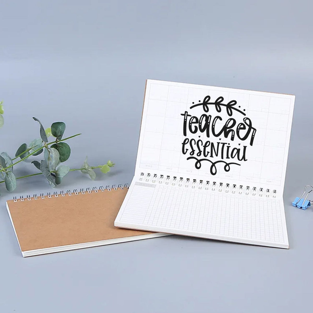 Teacher Essential Leafy Flourish Premium Wood-Mounted Stamp - Vintage Pro imprint stamped in black ink. "Teacher Essential" is framed by a leafy arch and looping flourish below.
