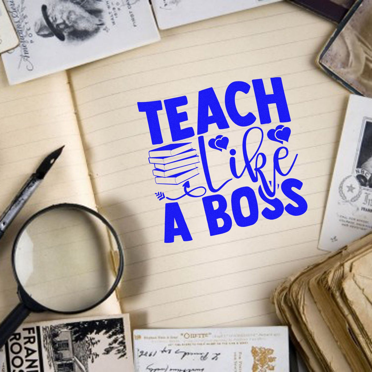 Teach Like a Boss rubber stamp design in bold blue on notebook, perfect for teacher planners, journals, and classroom crafts.