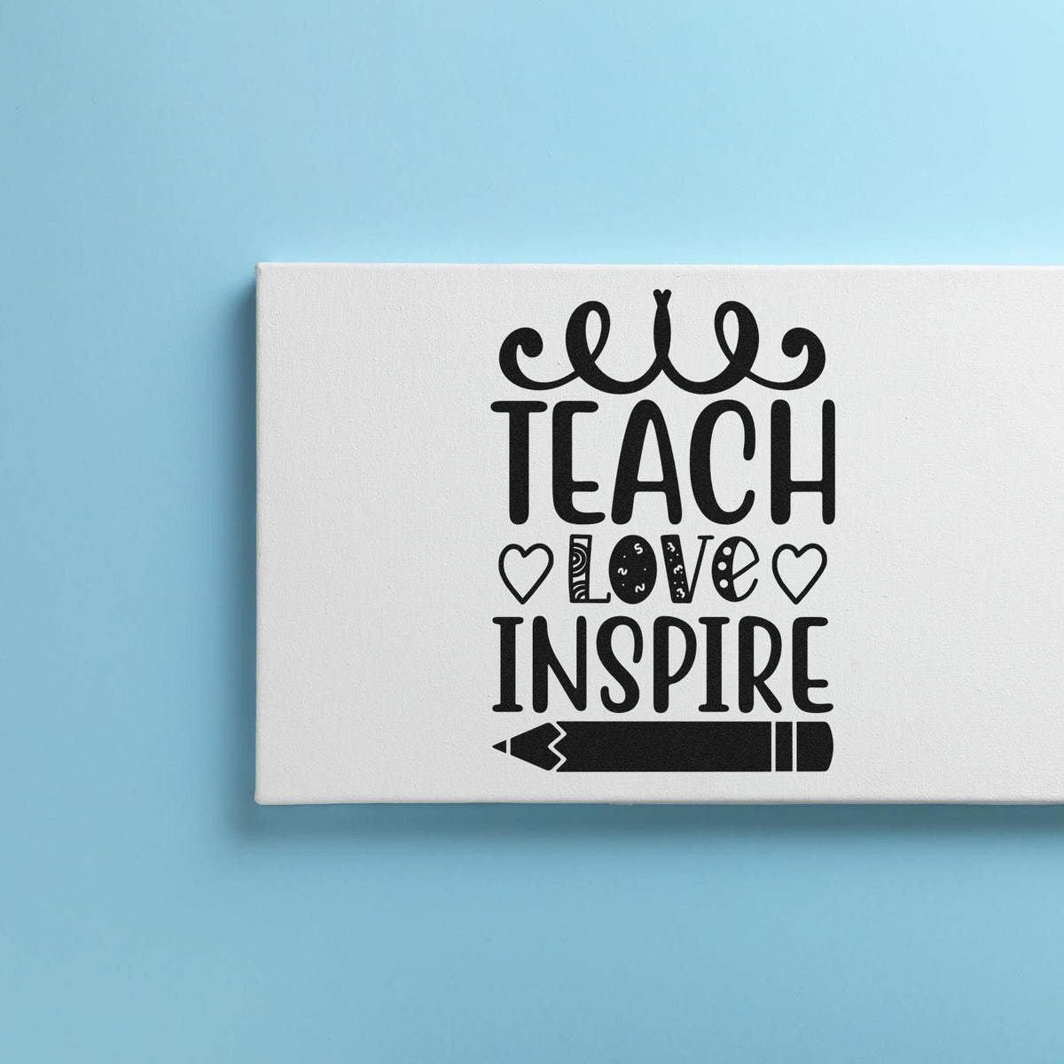 Teacher rubber stamp design reading Teach Love Inspire with hearts and pencil graphic for classroom crafts.