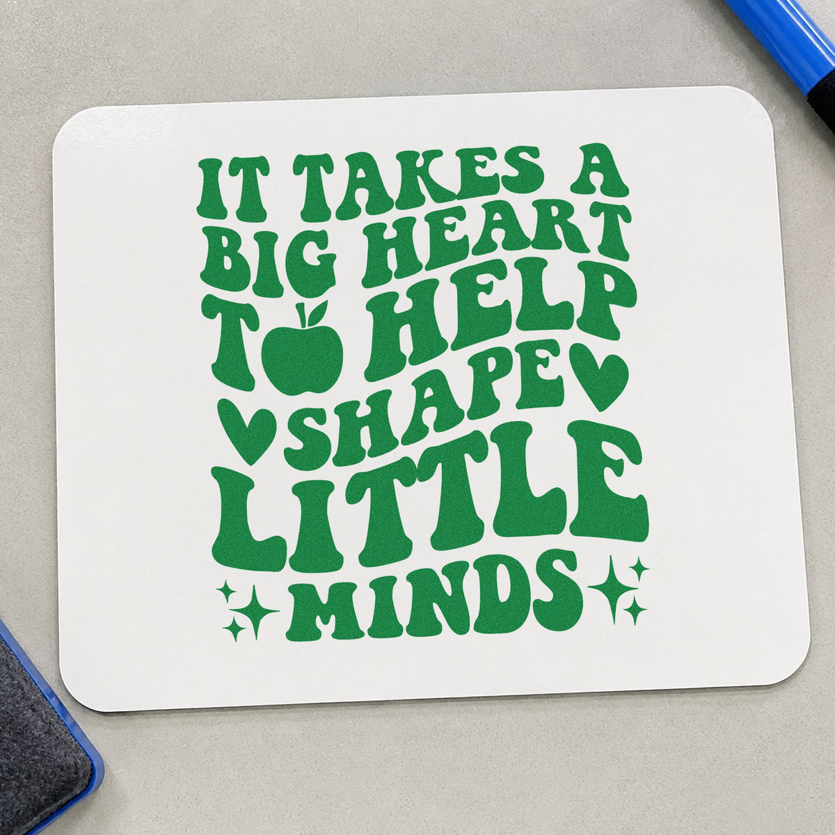 Big Heart Shape Little Minds craft stamp imprint in green ink on a handmade project, one idea being framed booth corner.