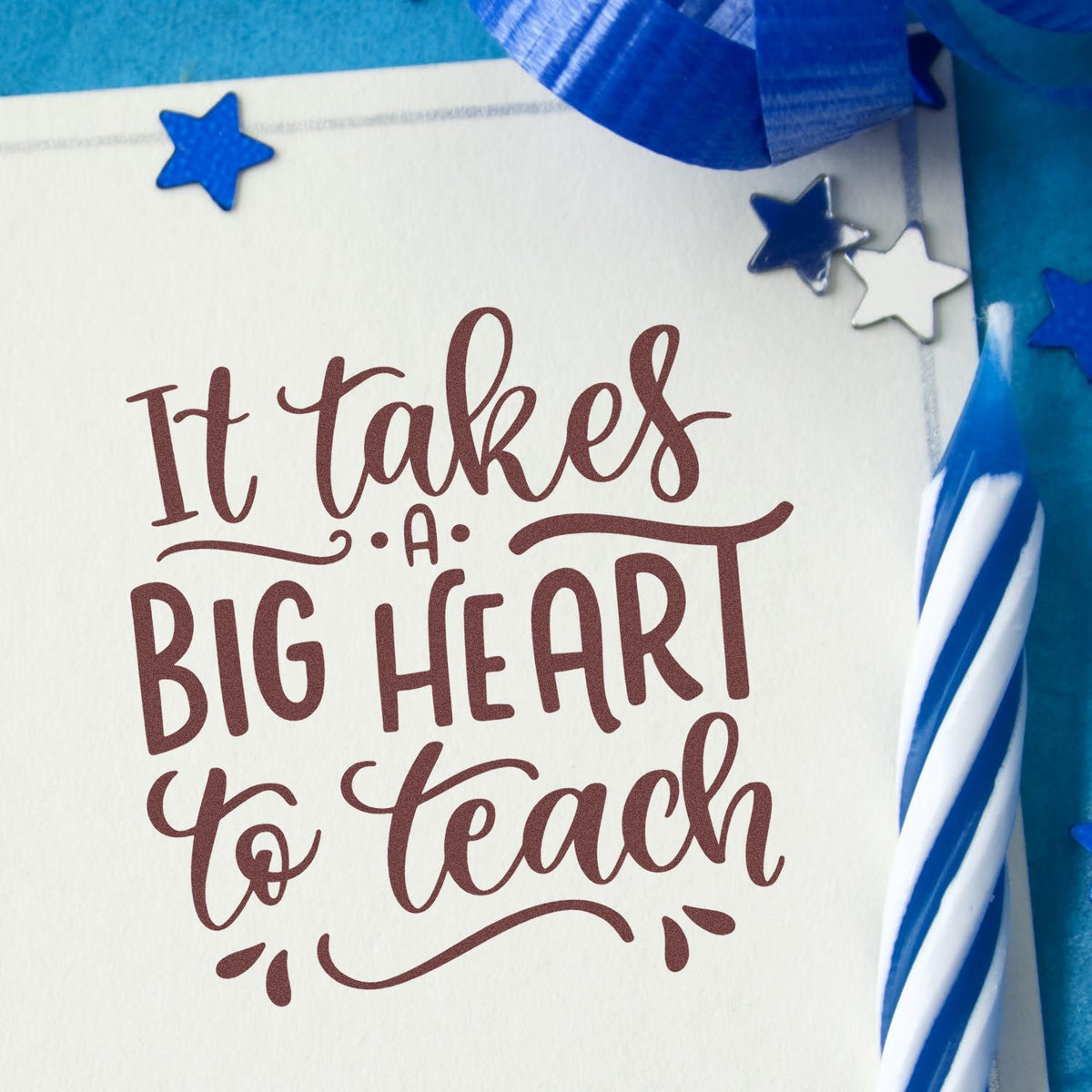 Teacher appreciation rubber stamp reading It takes a big heart to teach on white card with blue stars and ribbon.