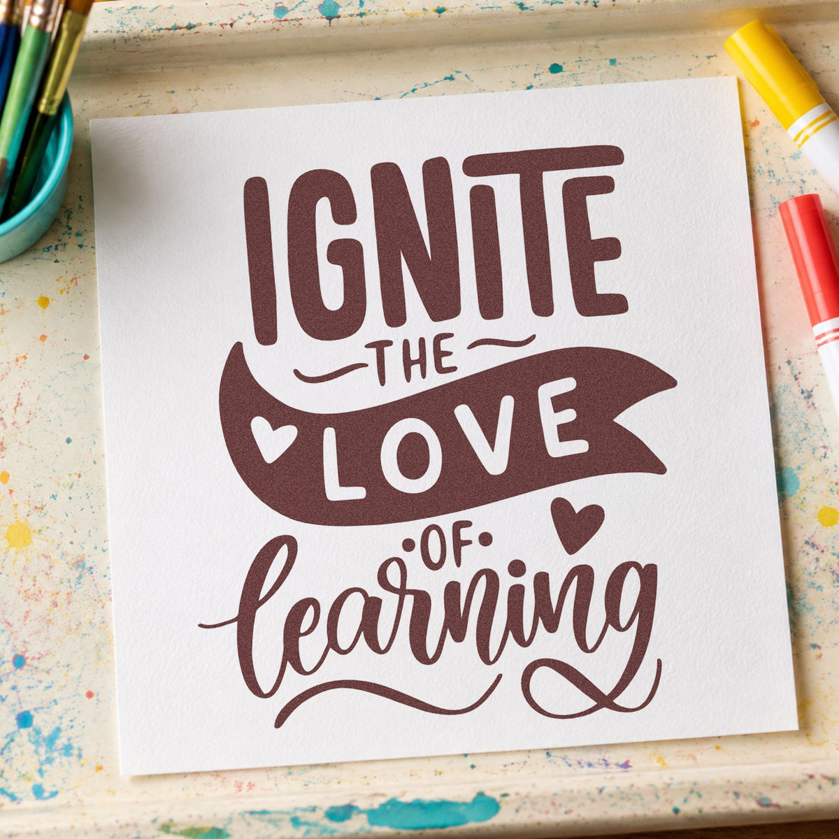 Ignite Love Of Learning rubber stamp printed in brown ink, ready for discovery box labels and similar paper crafts.