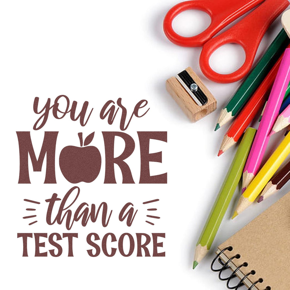 Rubber stamp design with You are more than a test score message, perfect for teacher encouragement and school crafts.