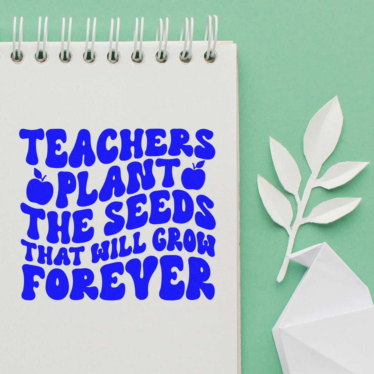 Teacher appreciation rubber stamp with quote, Teachers plant the seeds that will grow forever, in bold blue lettering.