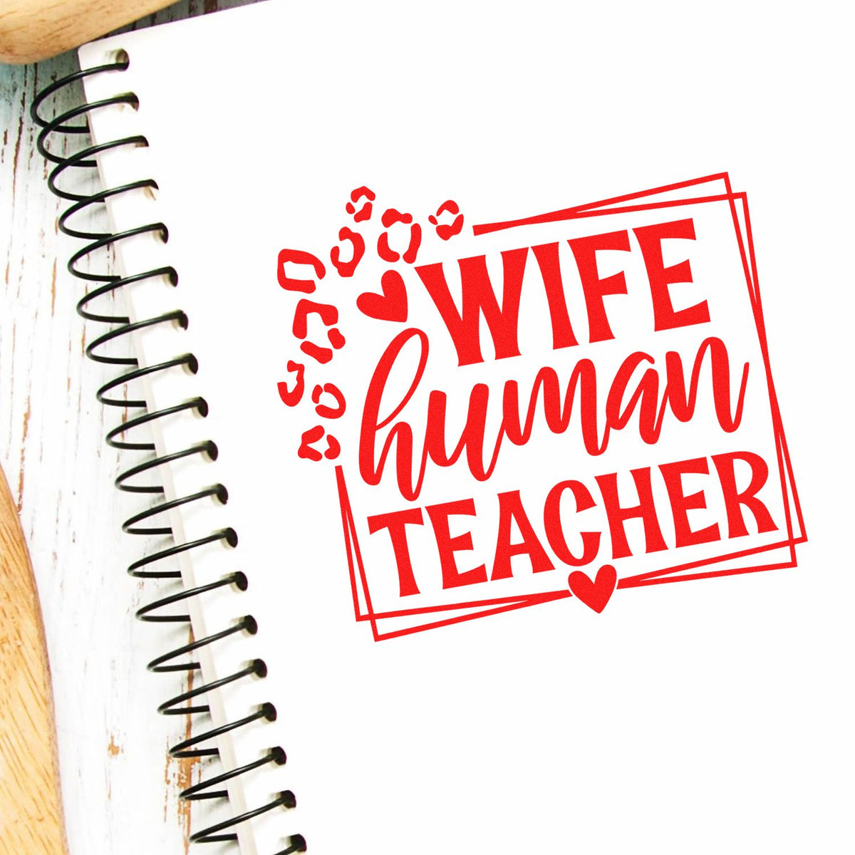 Red wife human teacher rubber stamp design on notebook, a personalized teacher gift stamp with bold custom lettering and heart accents
