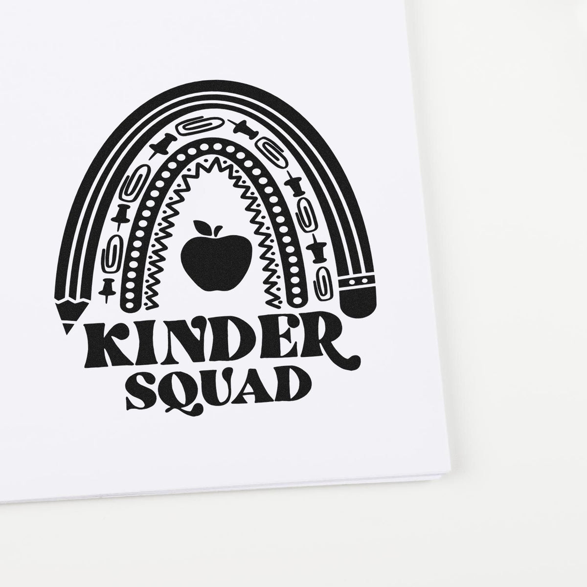 Kindersquad rainbow apple rubber stamp design for classroom crafts and teacher appreciation projects.