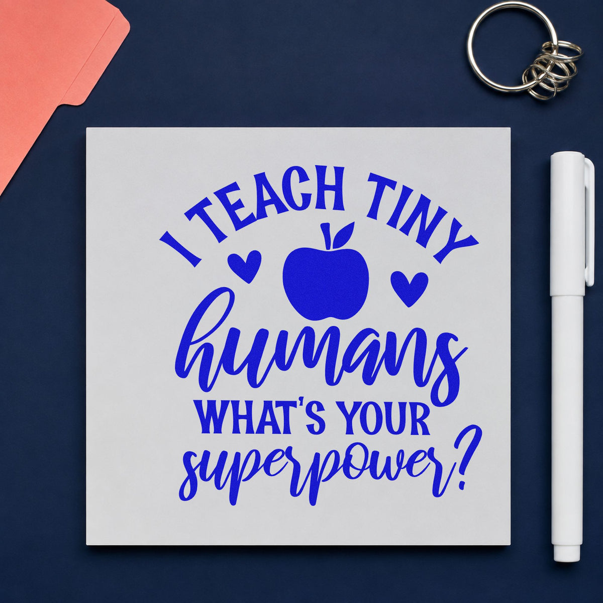 Teach Tiny Humans Superpower craft stamp imprinted in blue ink on paper, a design suited to job fair seals.