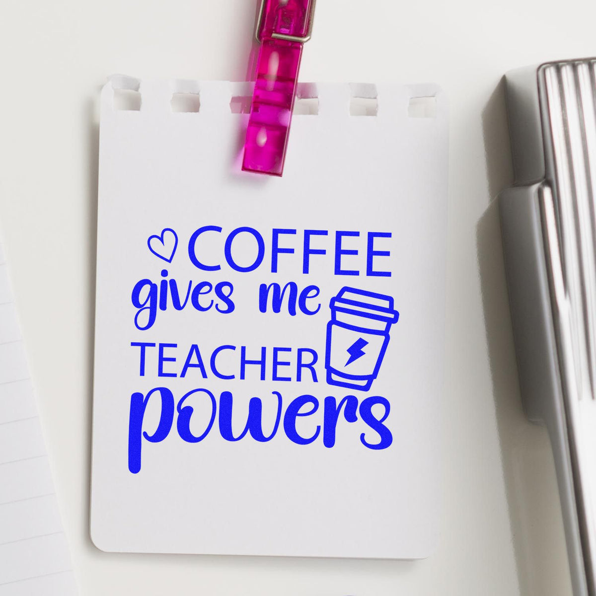 Custom rubber stamp reading Coffee Gives Me Teacher Powers on notebook page, a fun coffee-themed teacher gift.