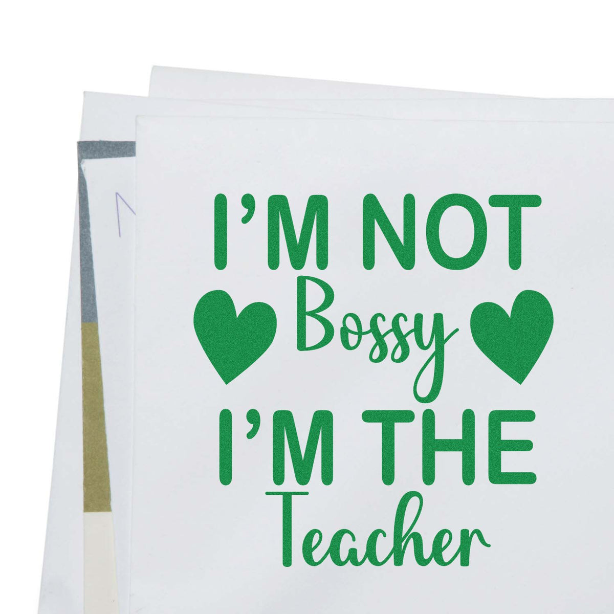 Teacher rubber stamp with quote Im not bossy Im the teacher and green hearts, perfect for classroom gifts and craft projects.