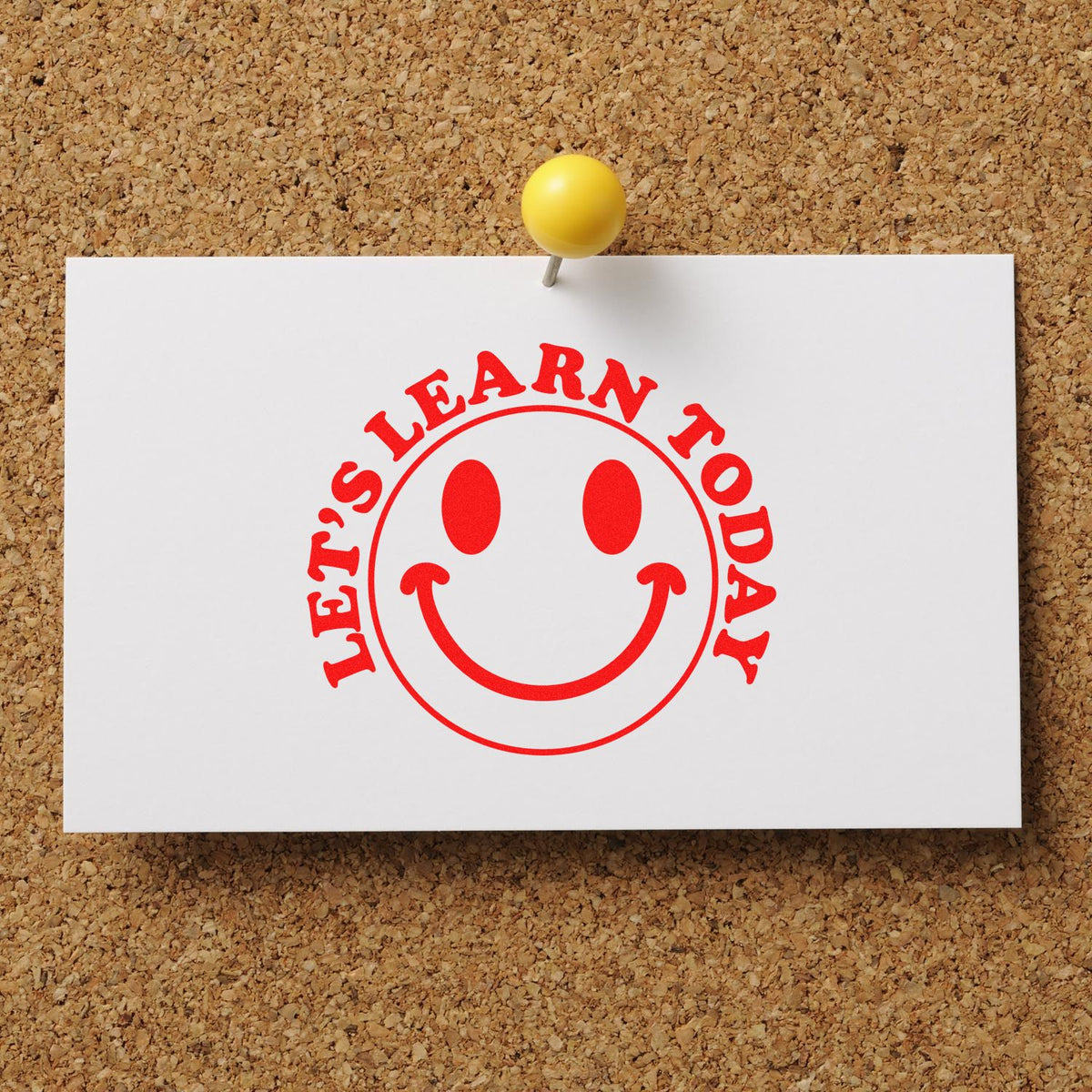 Lets Learn Today smiley face rubber stamp design for classroom, teacher, and educational projects pinned on corkboard.