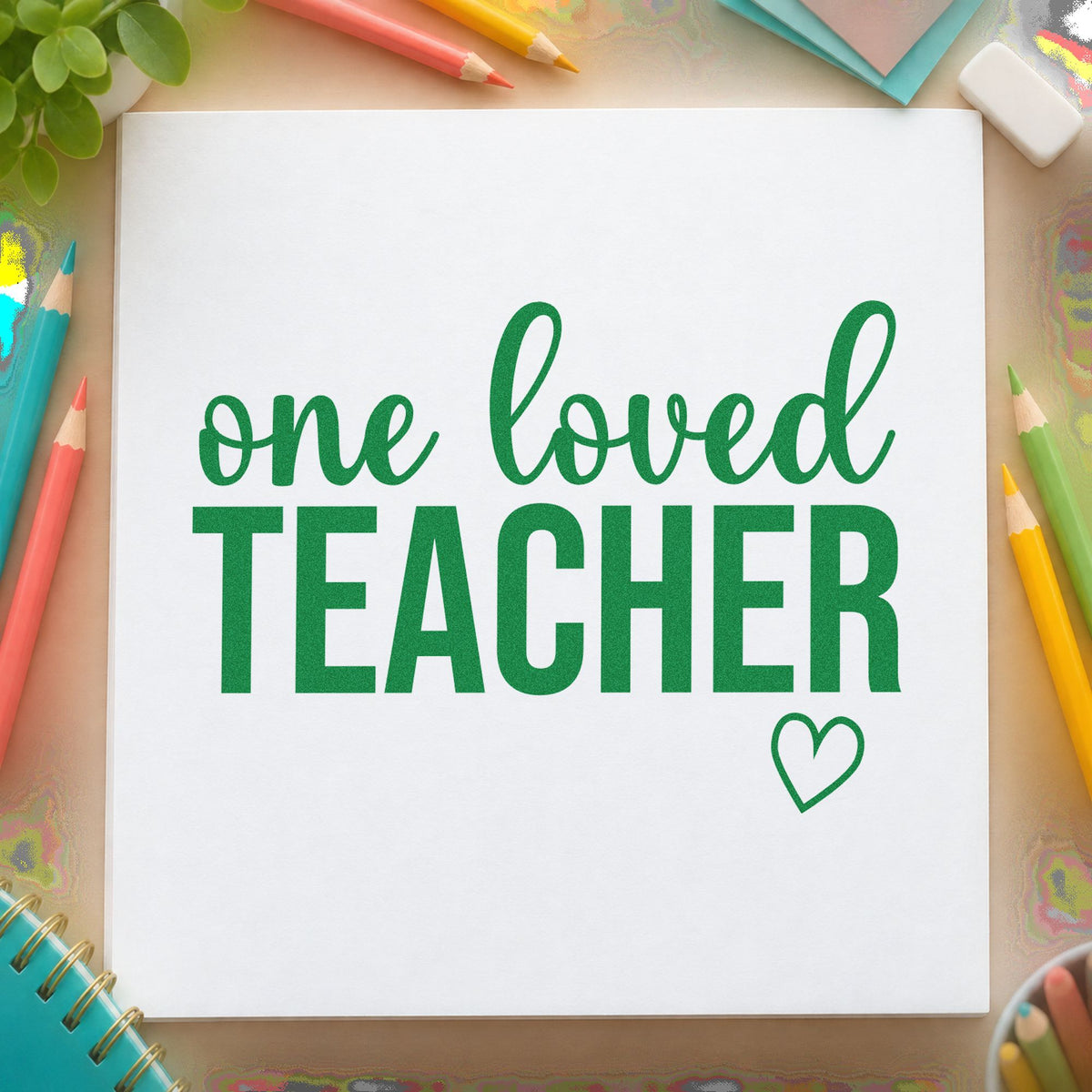 One Loved Teacher craft stamp imprint in green ink on a handmade project, one idea being framed honour ledge.