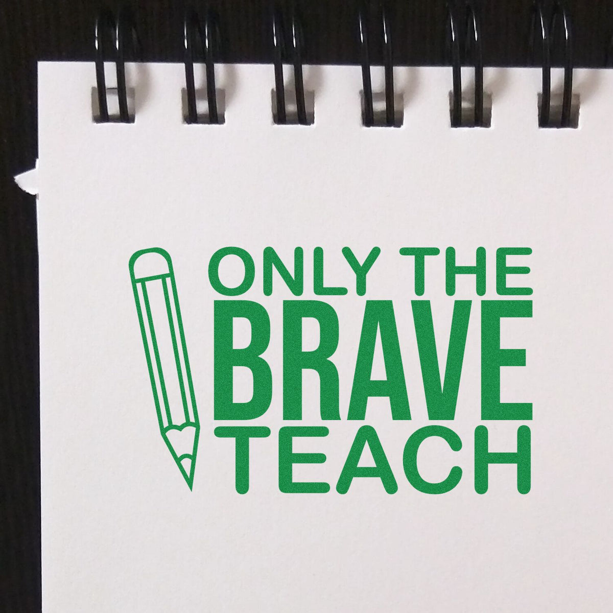 Teacher rubber stamp design with pencil icon and slogan Only the Brave Teach in green.