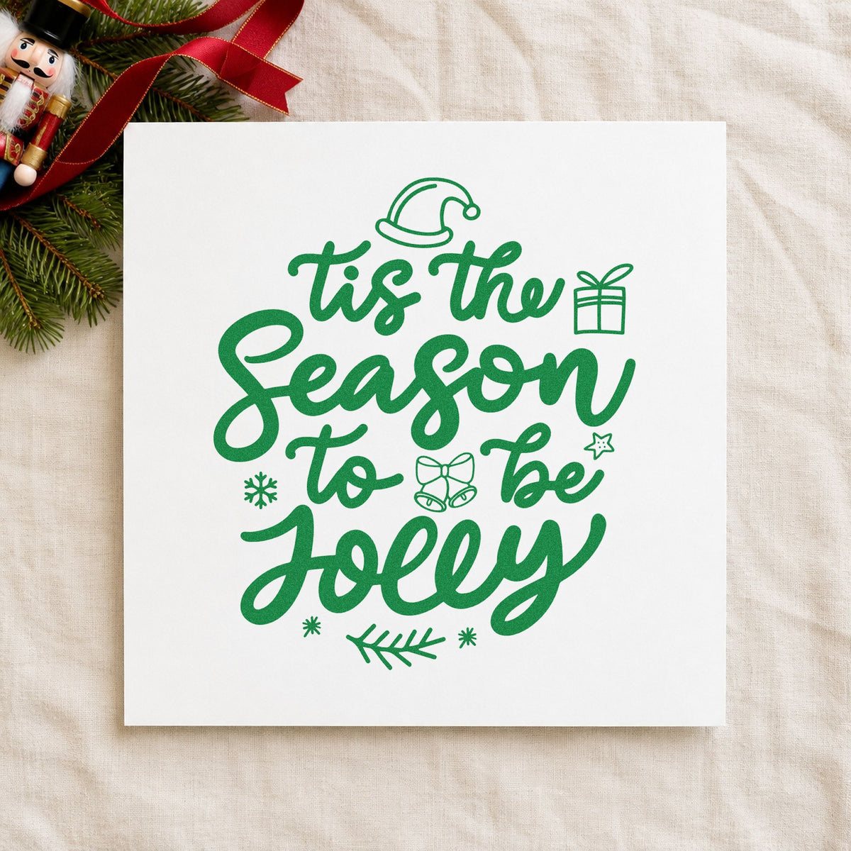 Tis Season To Be Jolly craft stamp imprint in green ink on a handmade project, one idea being advent count pages.