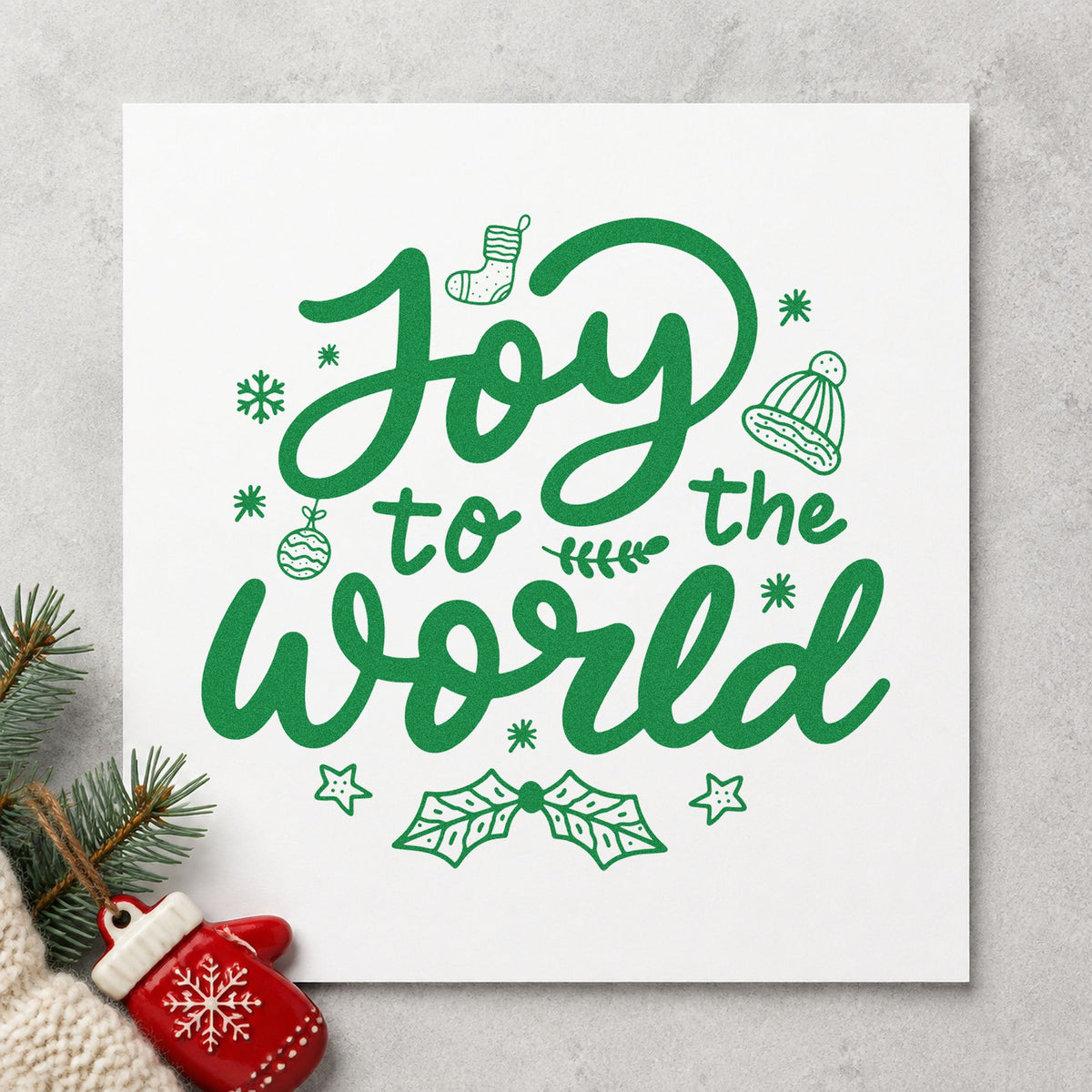 Joy To The World craft stamp imprinted in green ink on paper, a design suited to advent bag tags.