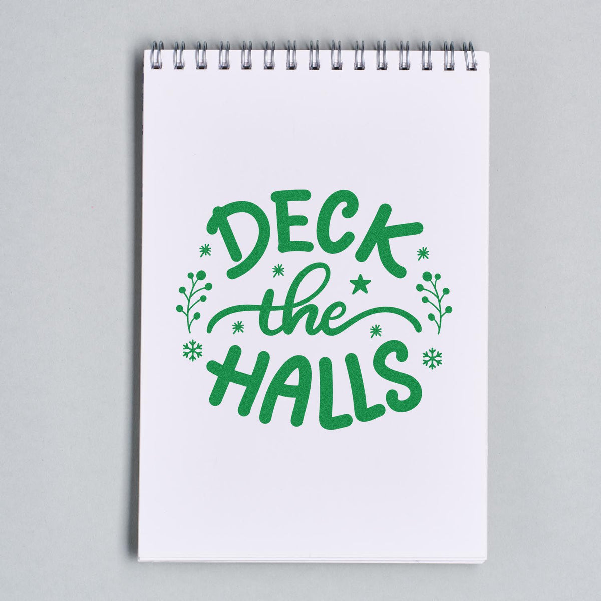 Deck The Halls Sprigs rubber stamp shown in green ink, stamped for projects such as decor box tags.