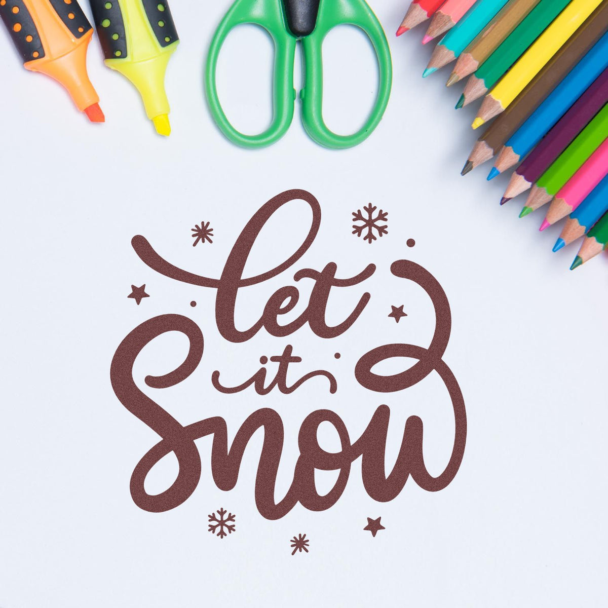 Let It Snow Script rubber stamp shown in brown ink, stamped for projects such as snow day tags.