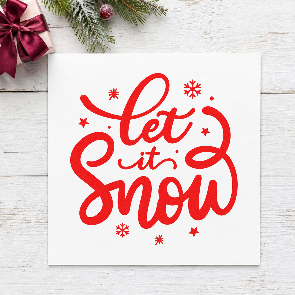 Let It Snow Script craft stamp in red ink on cardstock, an easy option for mitten cuff panels.
