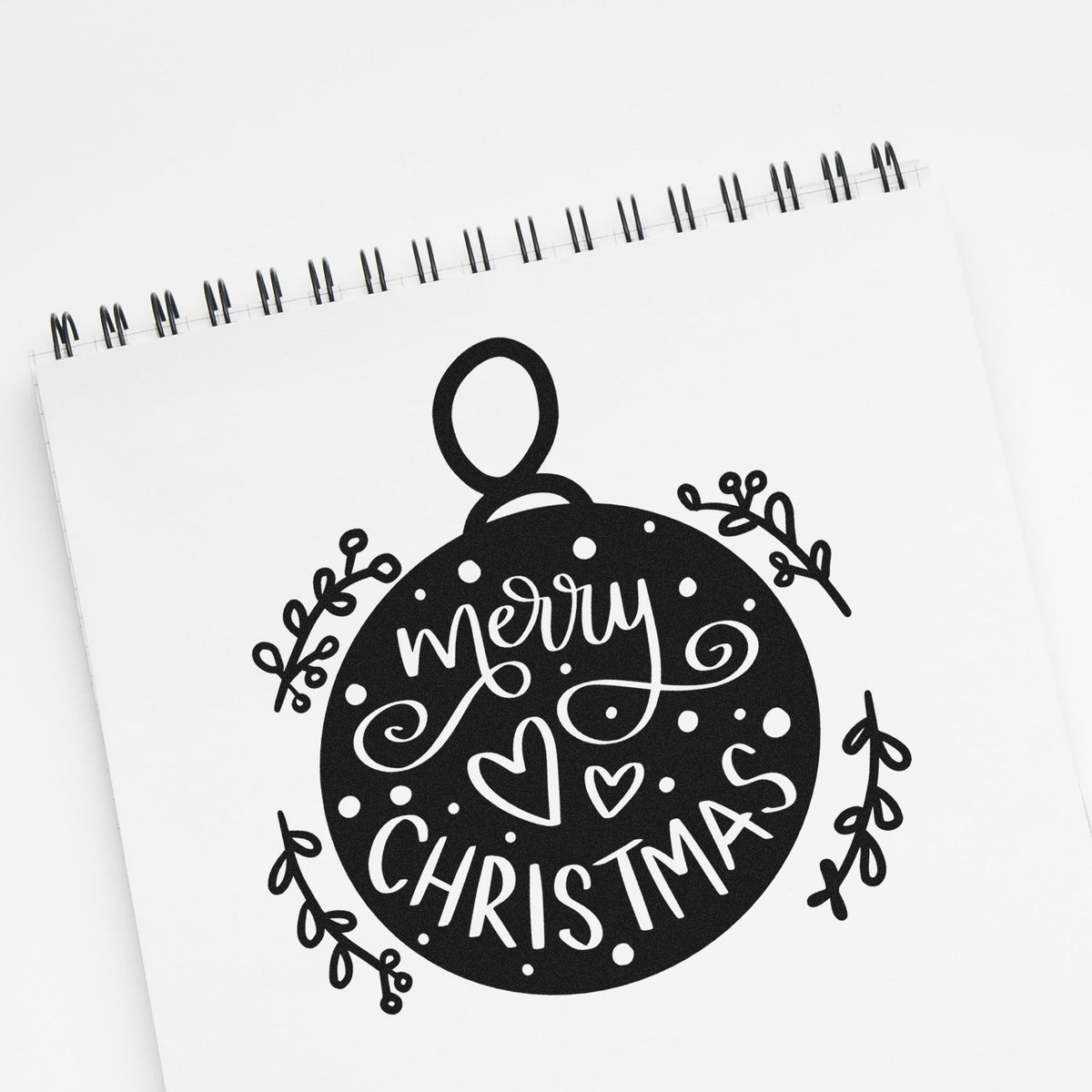 Merry Christmas ornament rubber stamp design on notebook page, perfect for holiday cards and festive scrapbooking.