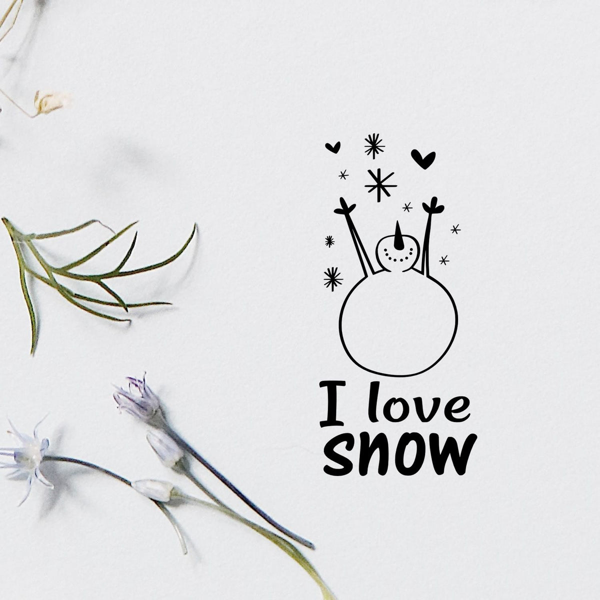 I Love Snow rubber stamp design with snowman, hearts and snowflakes on white paper for winter card making and crafts.