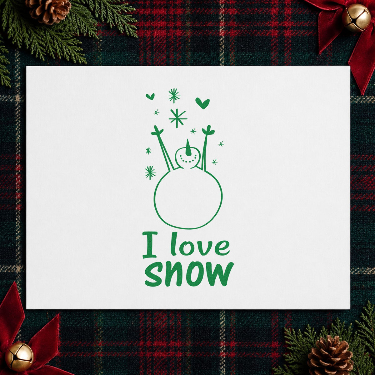 I Love Snow Snowman craft stamp imprint in green ink on a handmade project, one idea being winter craft pages.