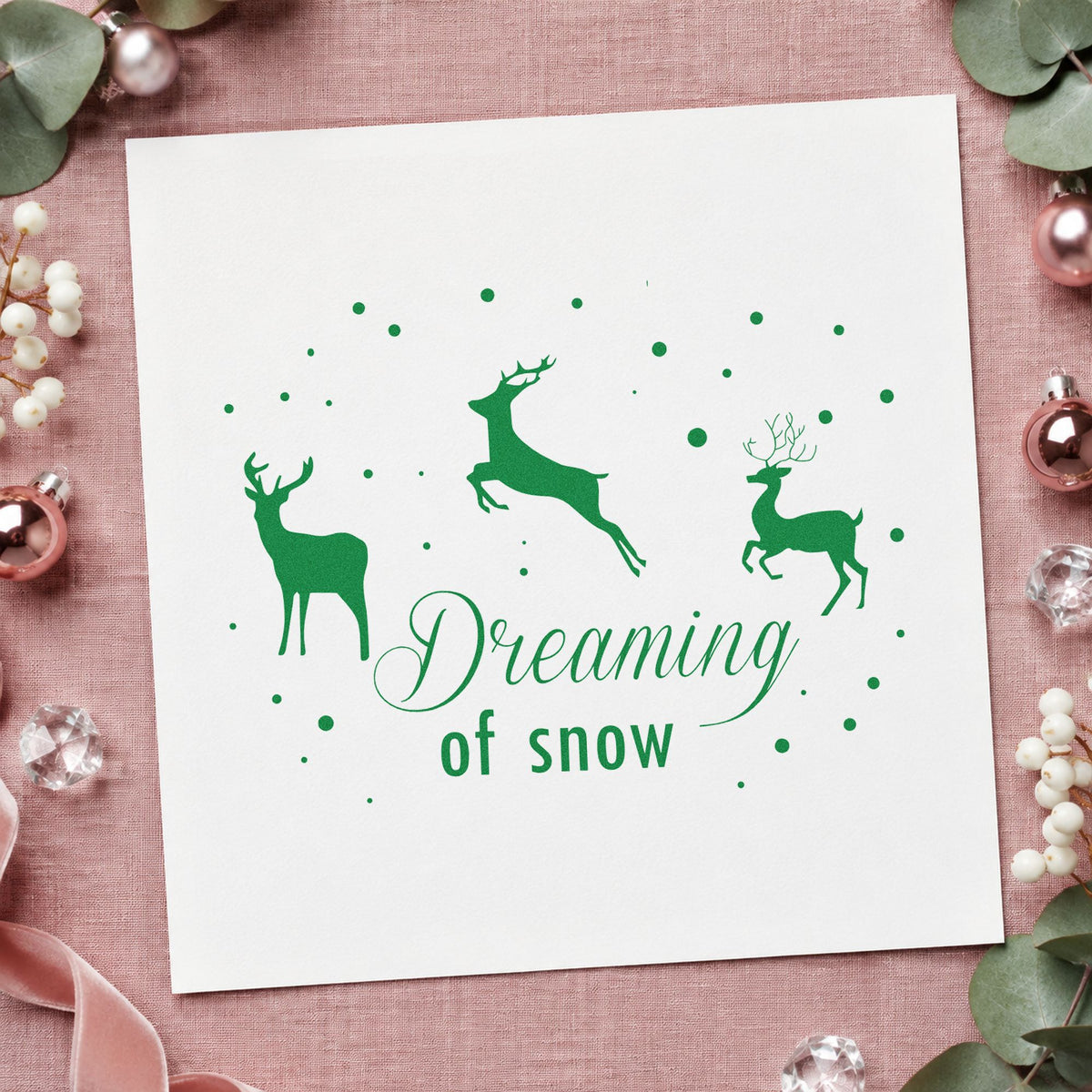 Dreaming Of Snow Reindeer craft stamp imprinted in green ink on paper, a design suited to trail map seals.
