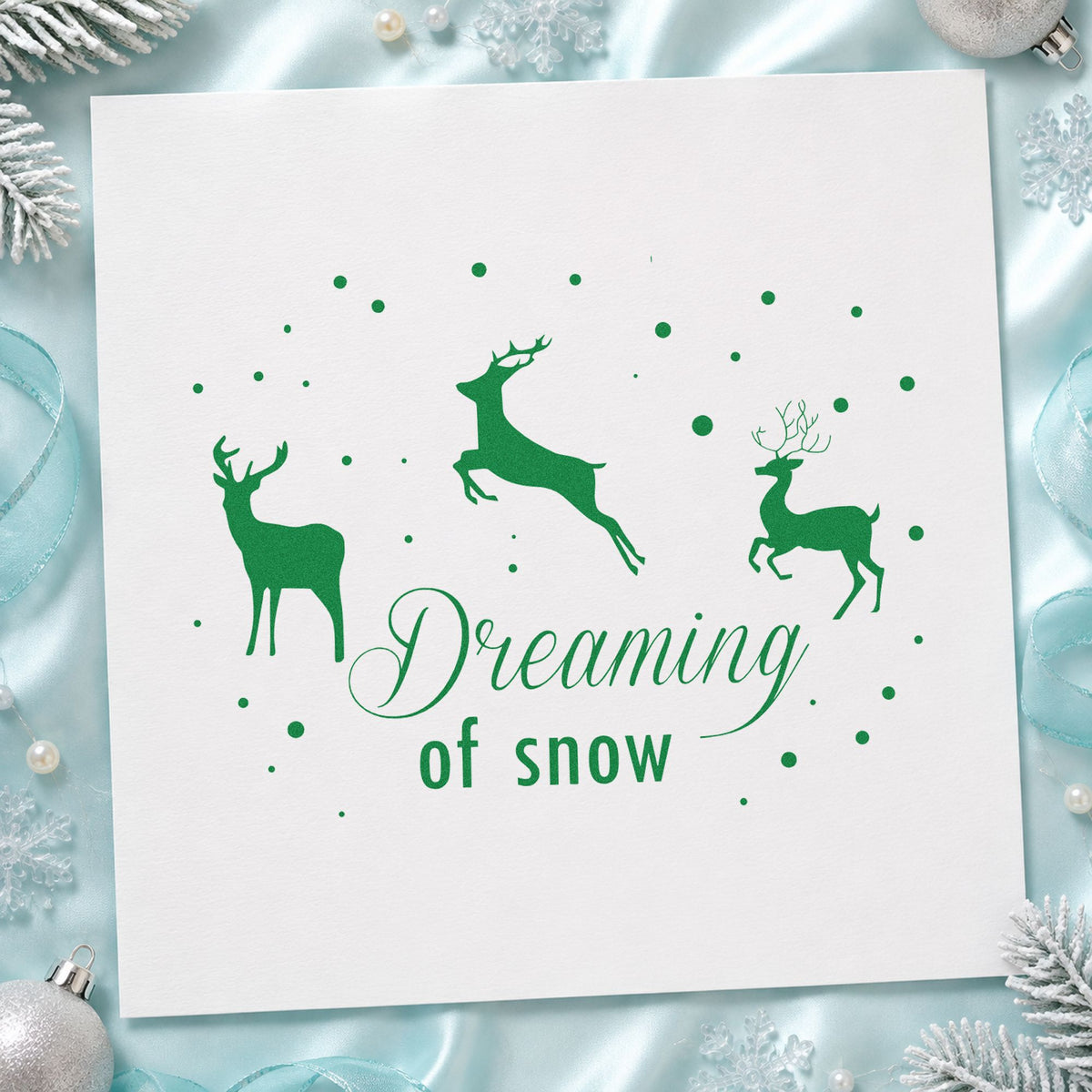 Dreaming Of Snow Reindeer craft stamp imprint in green ink on a handmade project, one idea being framed lodge wall.