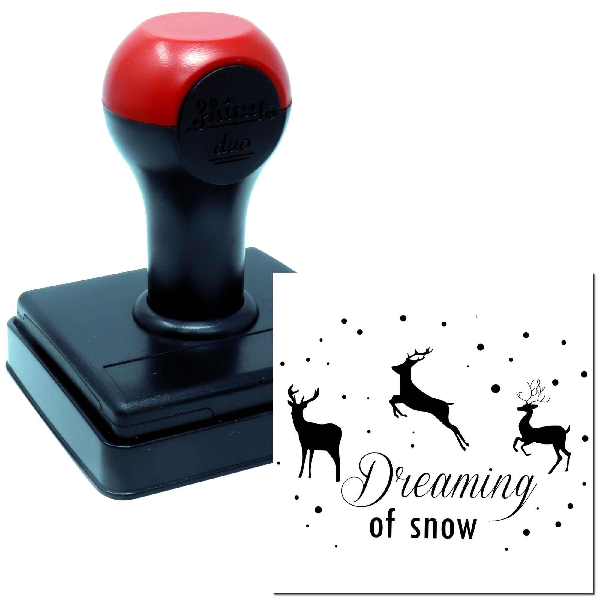 Self-inking rubber stamp featuring deer and Dreaming of Snow design for winter-themed crafting.