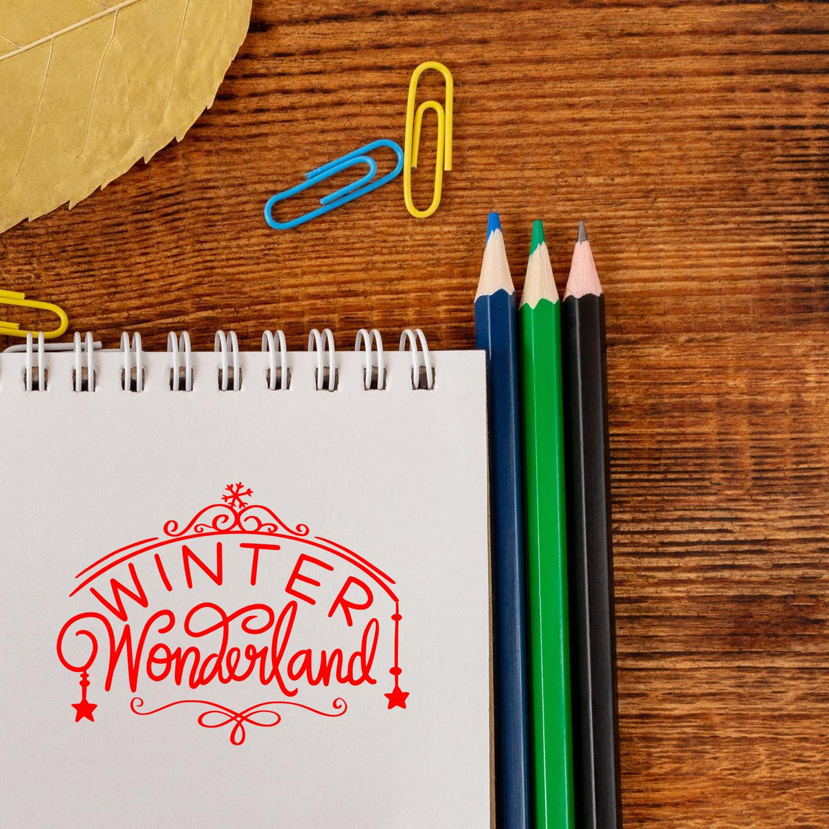 Winter Wonderland rubber stamp impression on notebook for festive holiday crafting, journaling, and custom stationery.