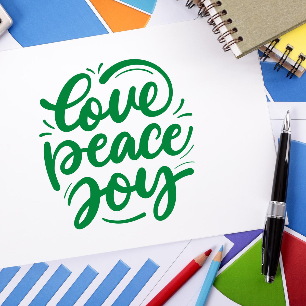 Custom rubber stamp design with green love peace joy script, perfect for craft, stationery, and greeting card projects.