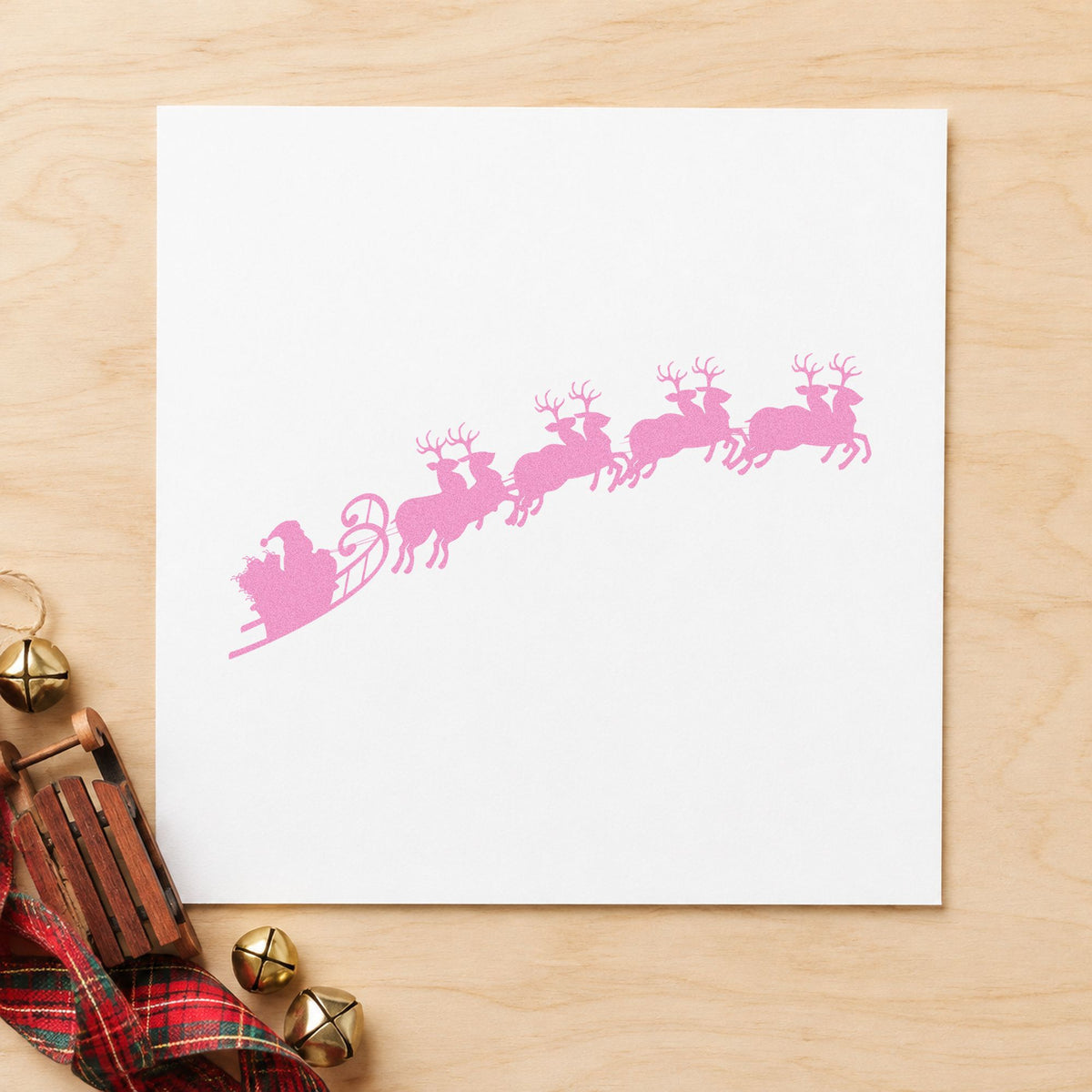 Santa Sleigh And Reindeer craft stamp in purple ink on cardstock, an easy option for flight path tags.