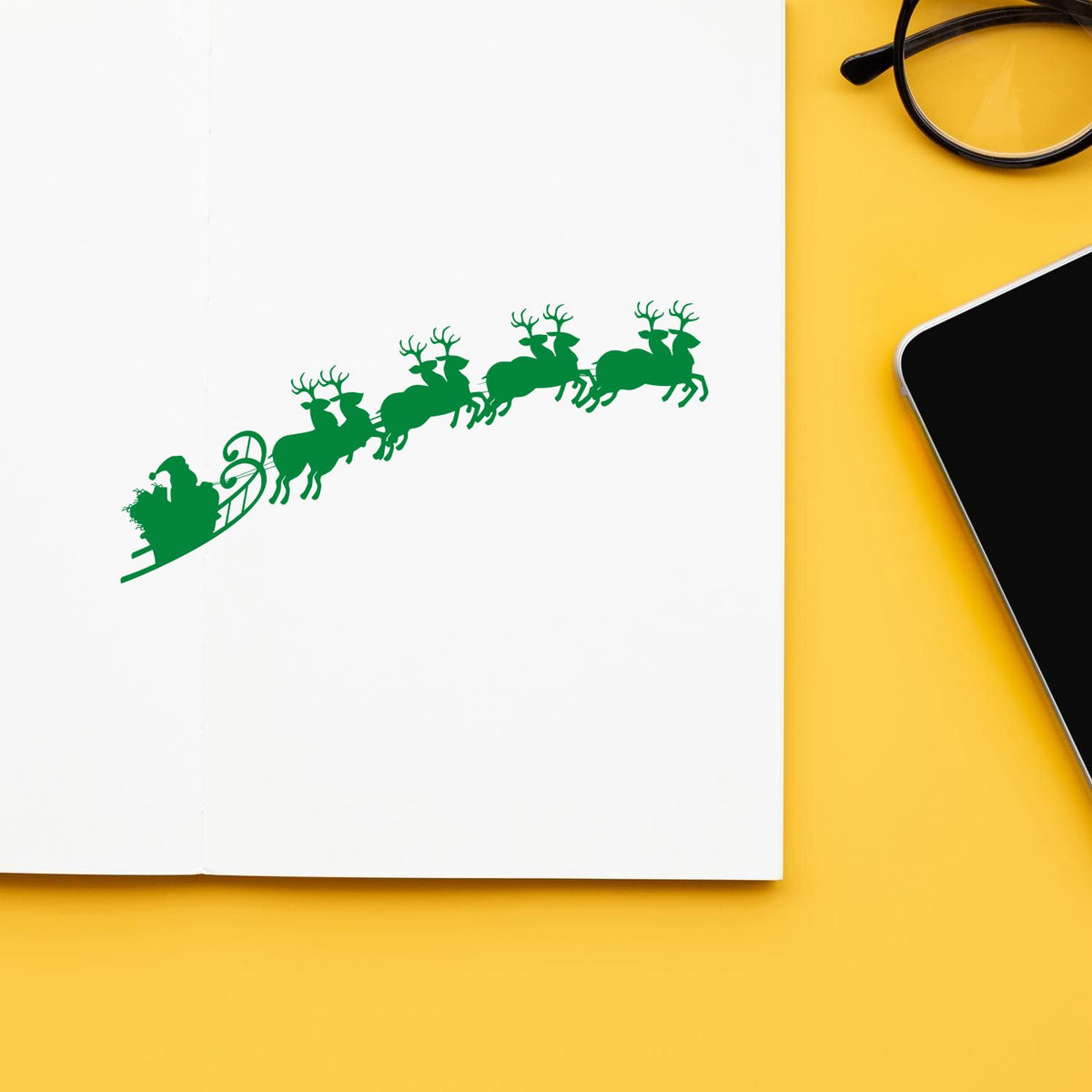 Santa Sleigh And Reindeer rubber stamp shown in green ink, stamped for projects such as flight path tags.