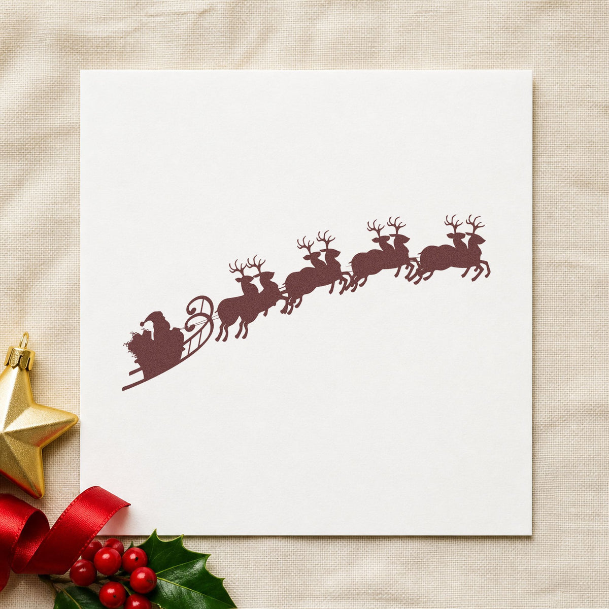 Santa Sleigh And Reindeer rubber stamp printed in brown ink, ready for gift sack labels and similar paper crafts.