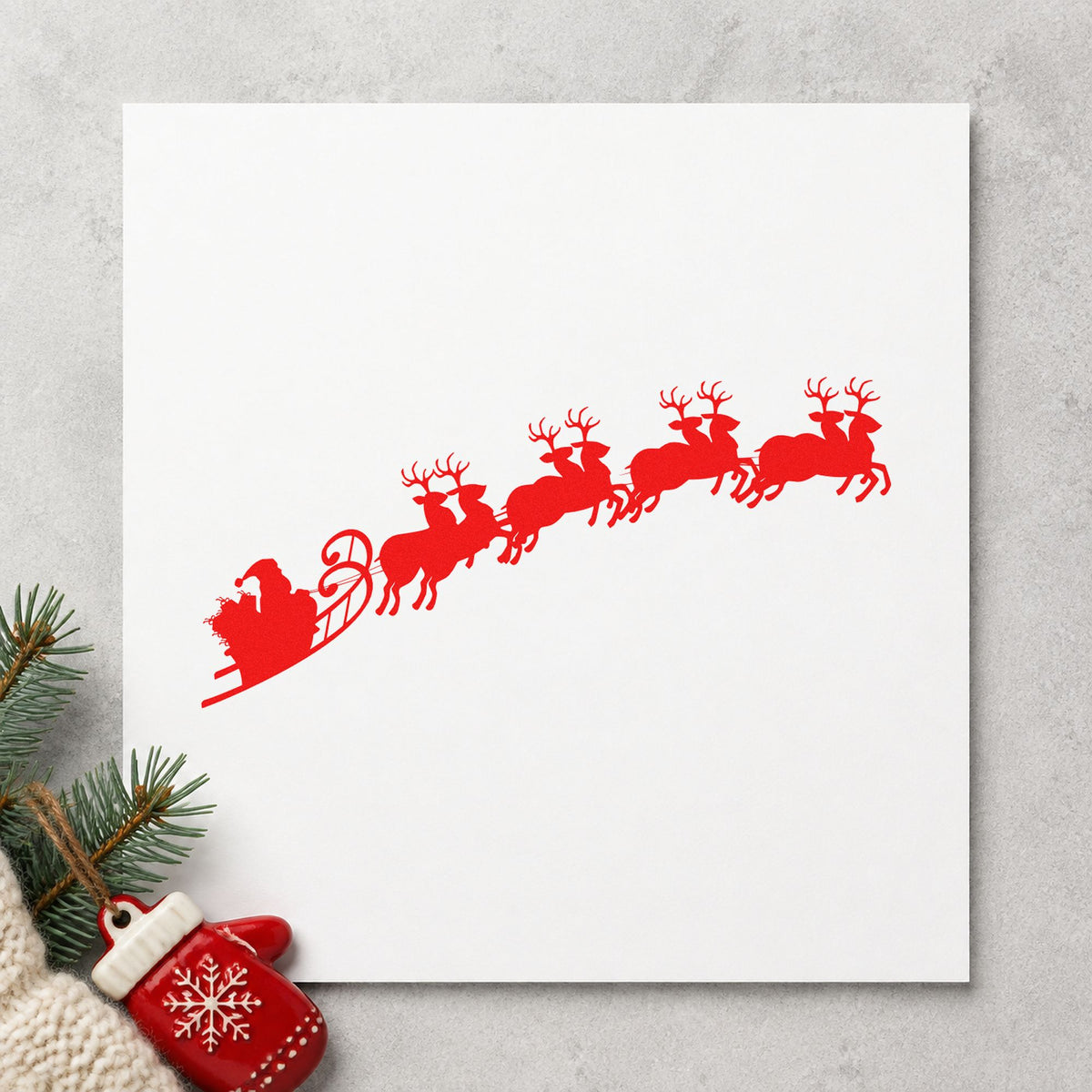 Santa Sleigh And Reindeer craft stamp in red ink on cardstock, an easy option for bunting sky panels.